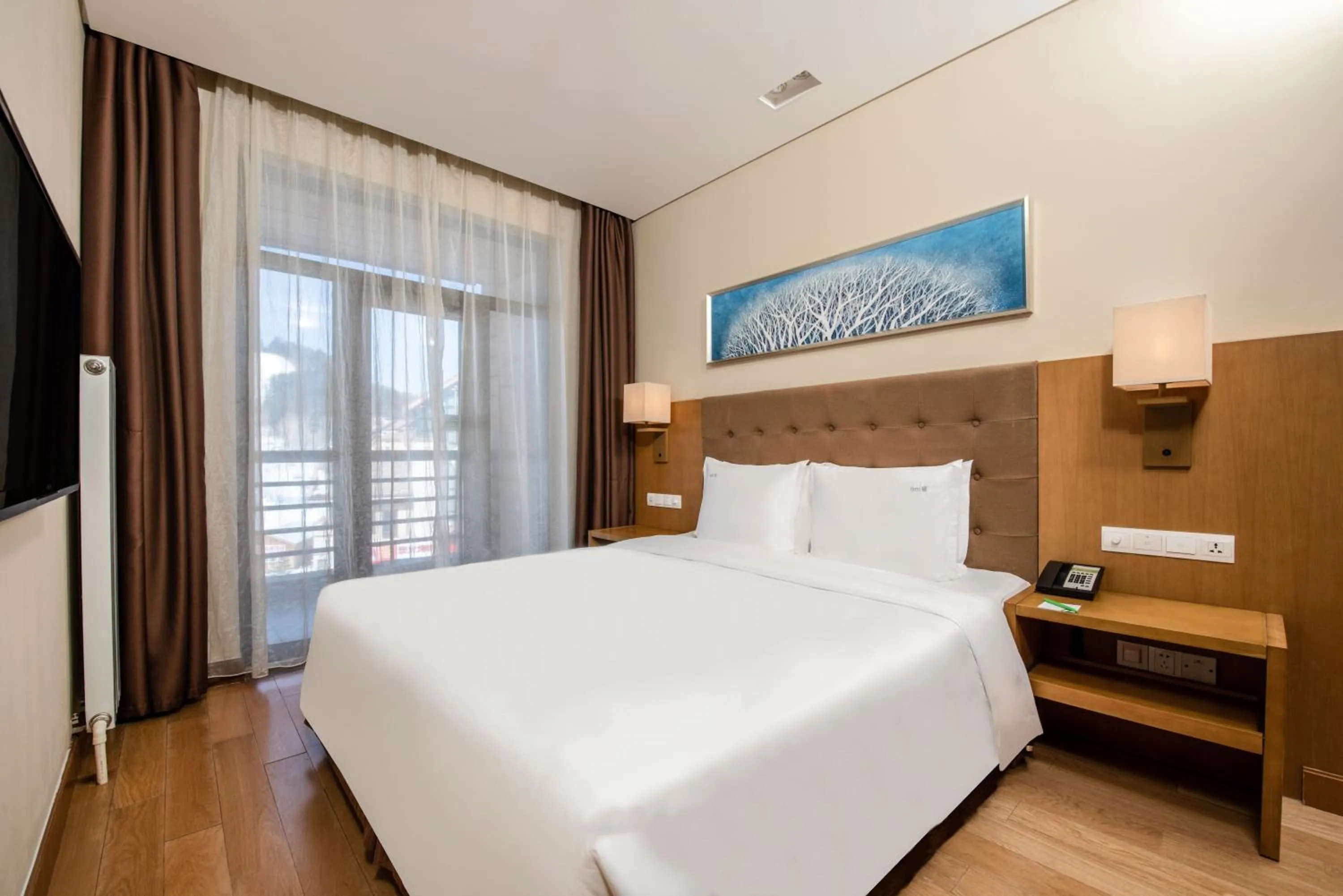 Bed in Wanda Jin Suites Changbaishan