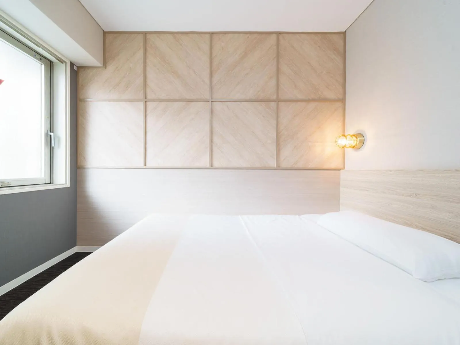 Bed in Super Hotel Midosujisen Esaka