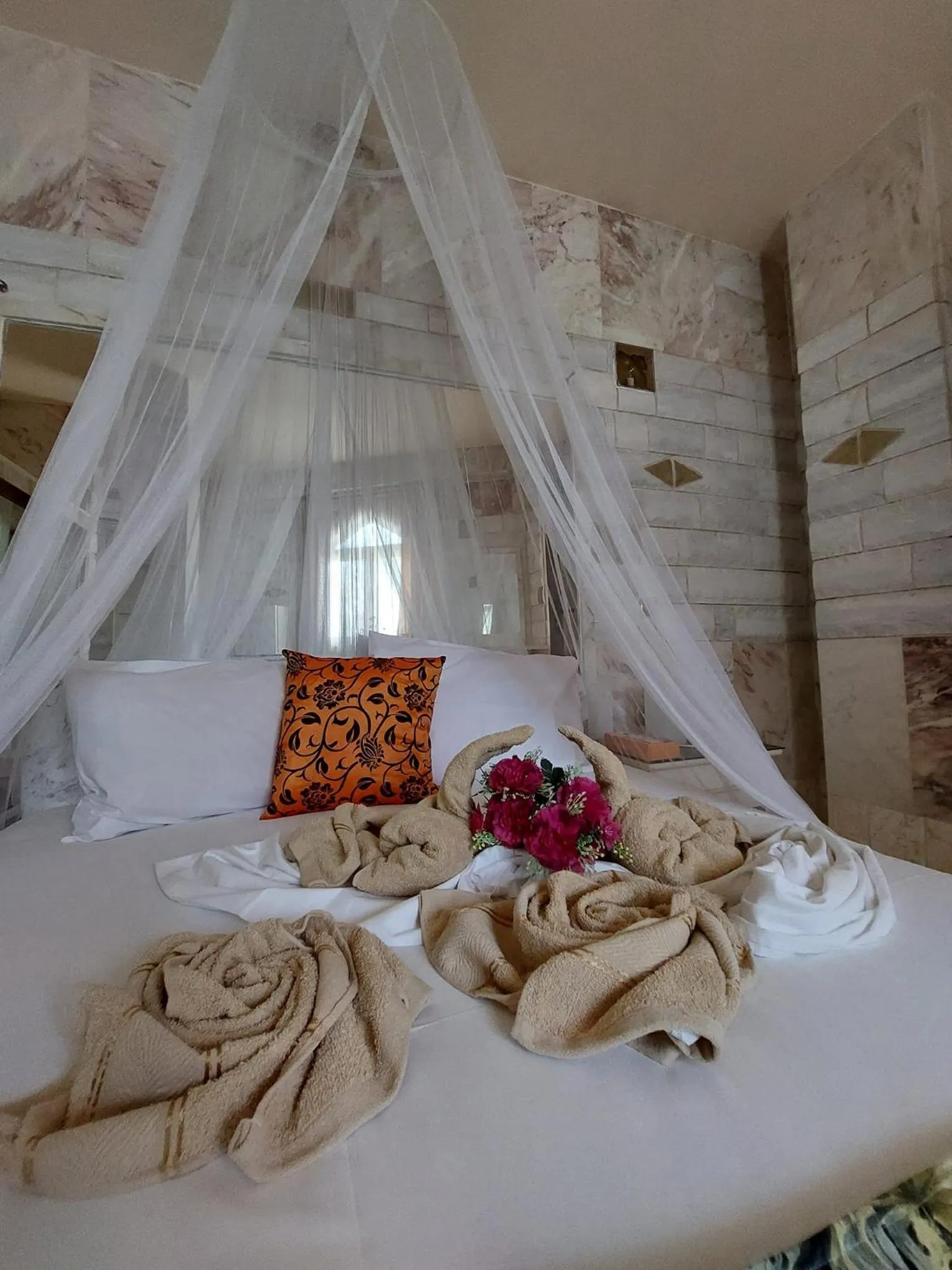 Bed in Paco's Resort Holiday Flats