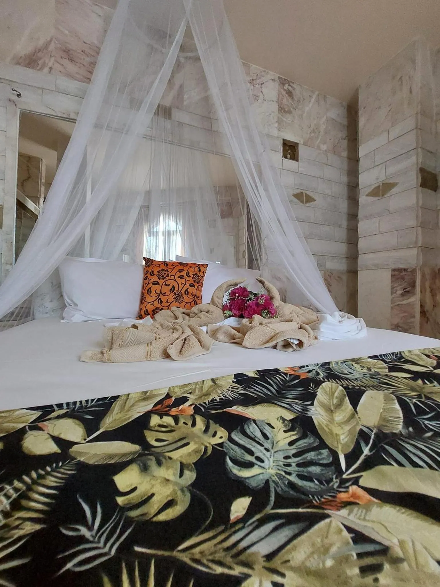 Bed in Paco's Resort Holiday Flats