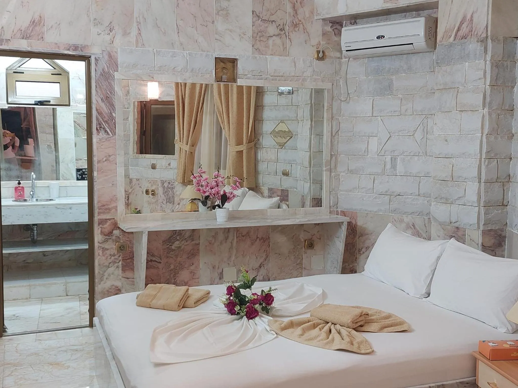 Bed in Paco's Resort Holiday Flats