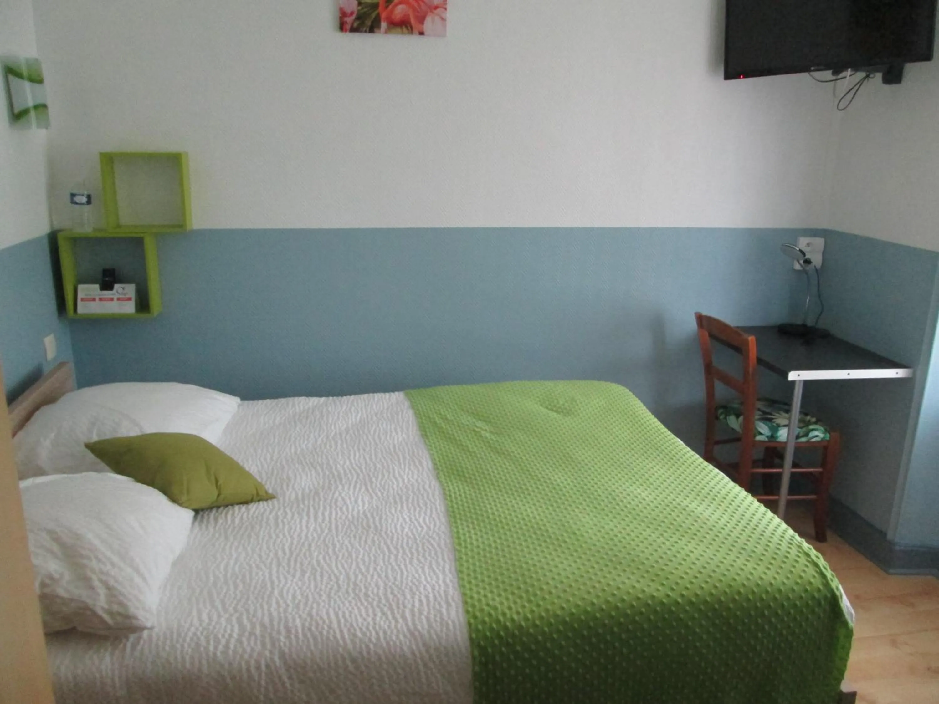 Bed in Logis Hôtel Beauséjour