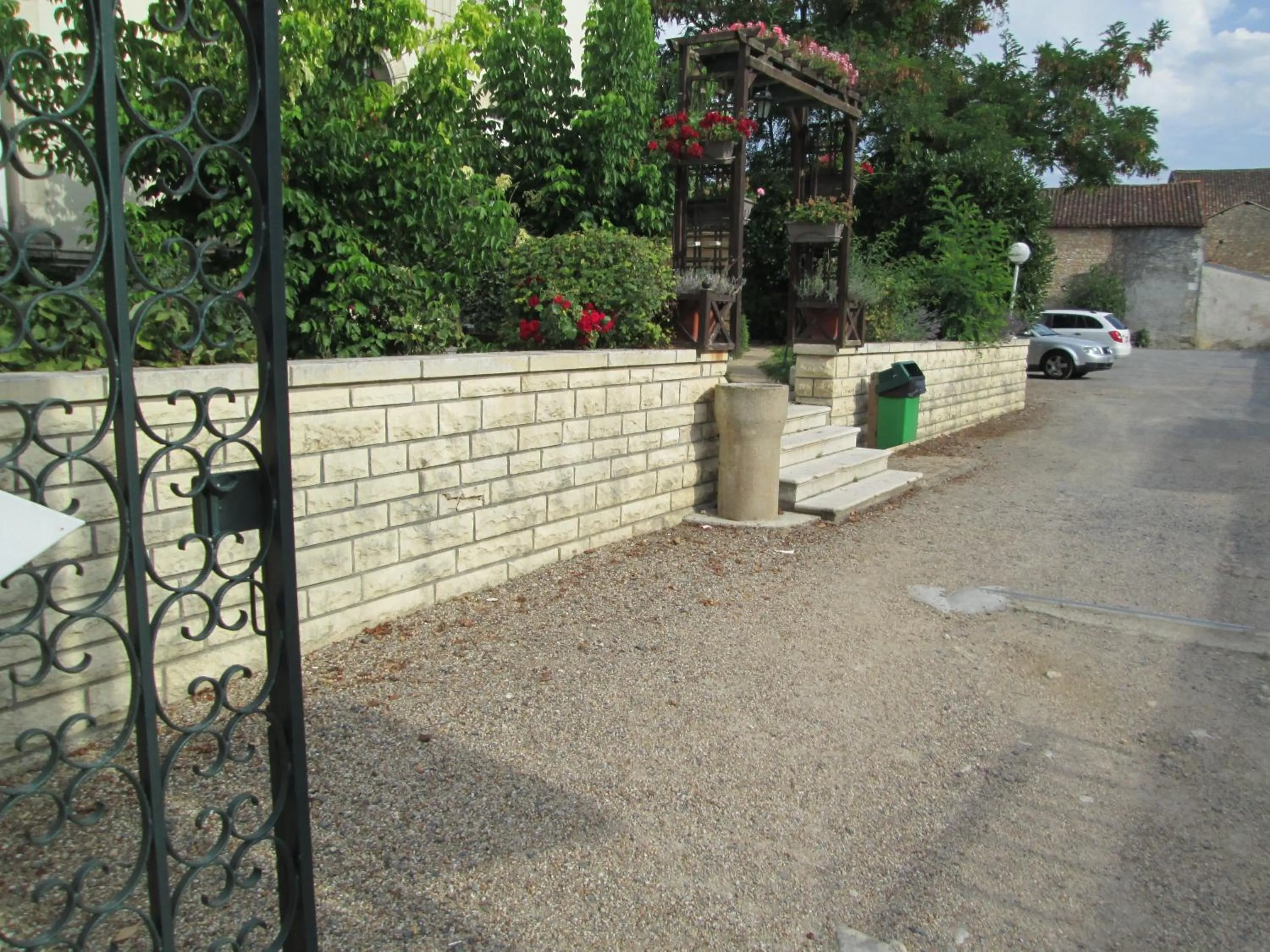 Garden view in Logis Hôtel Beauséjour