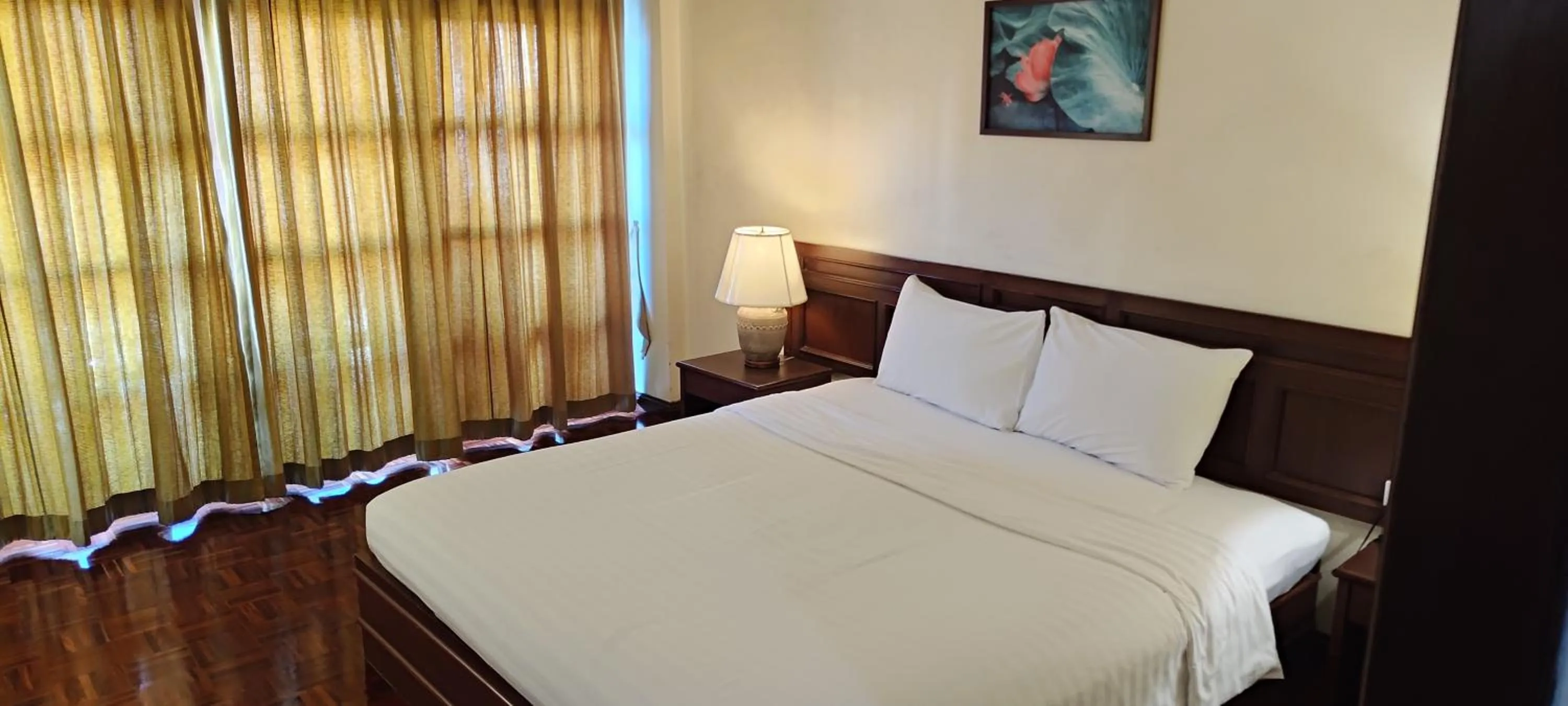 Bed in Puangpen Villa Hotel