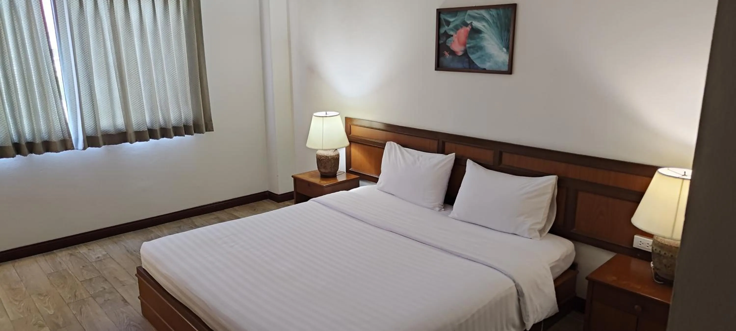 Bed in Puangpen Villa Hotel