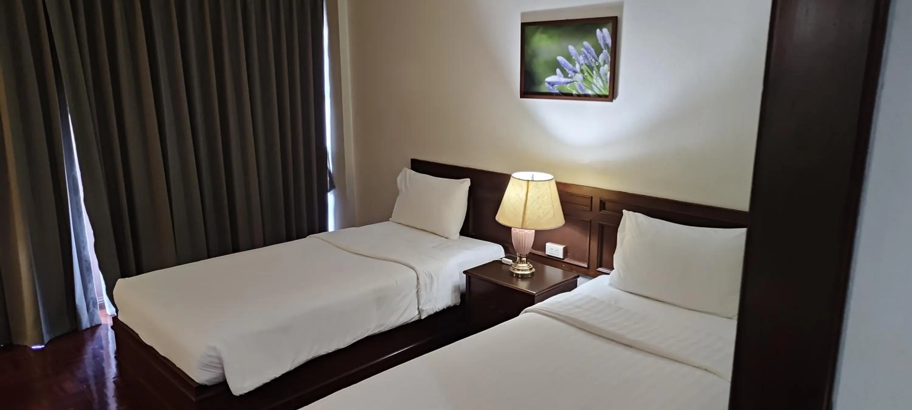 Bed in Puangpen Villa Hotel