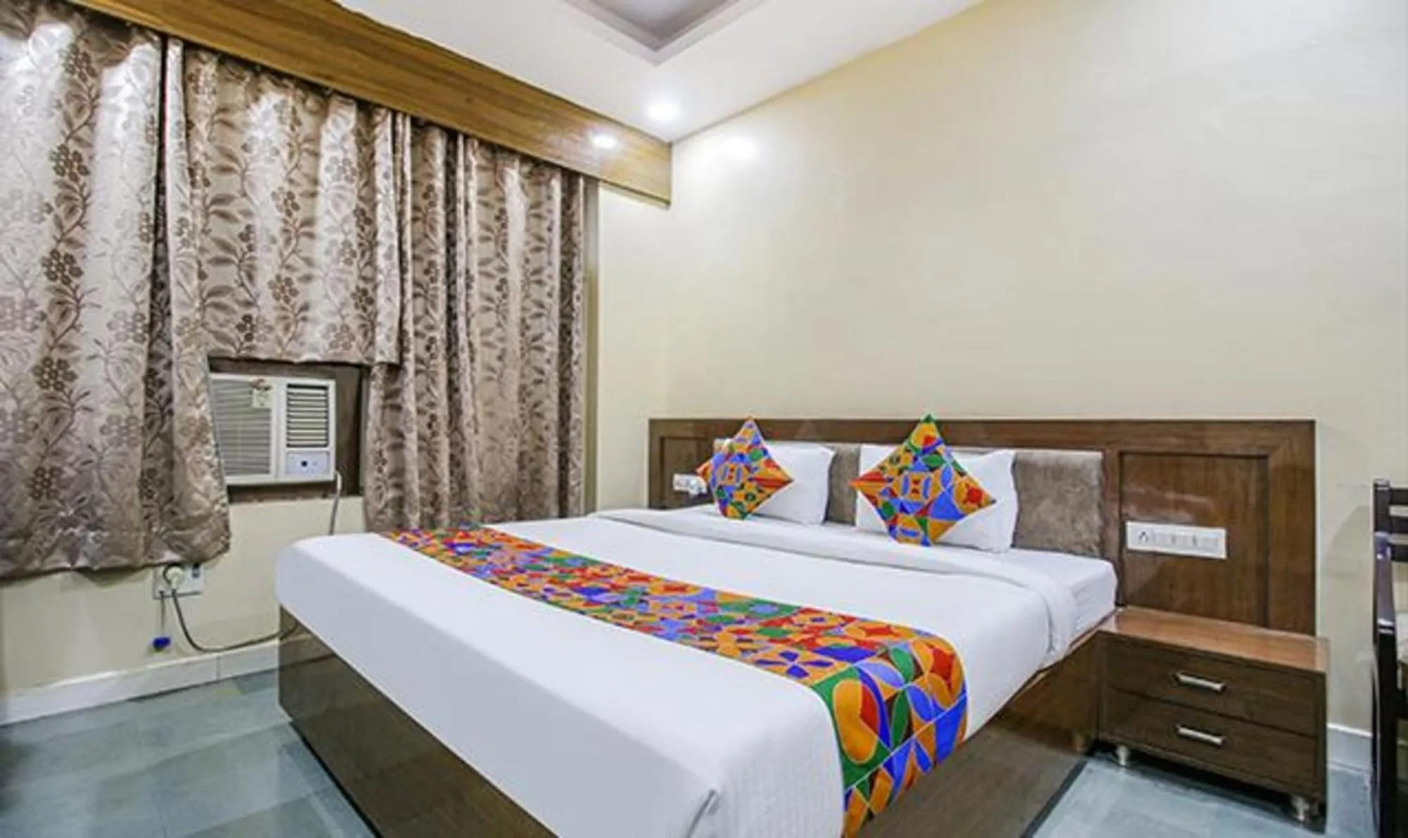 Bed in FabHotel Silver Inn I