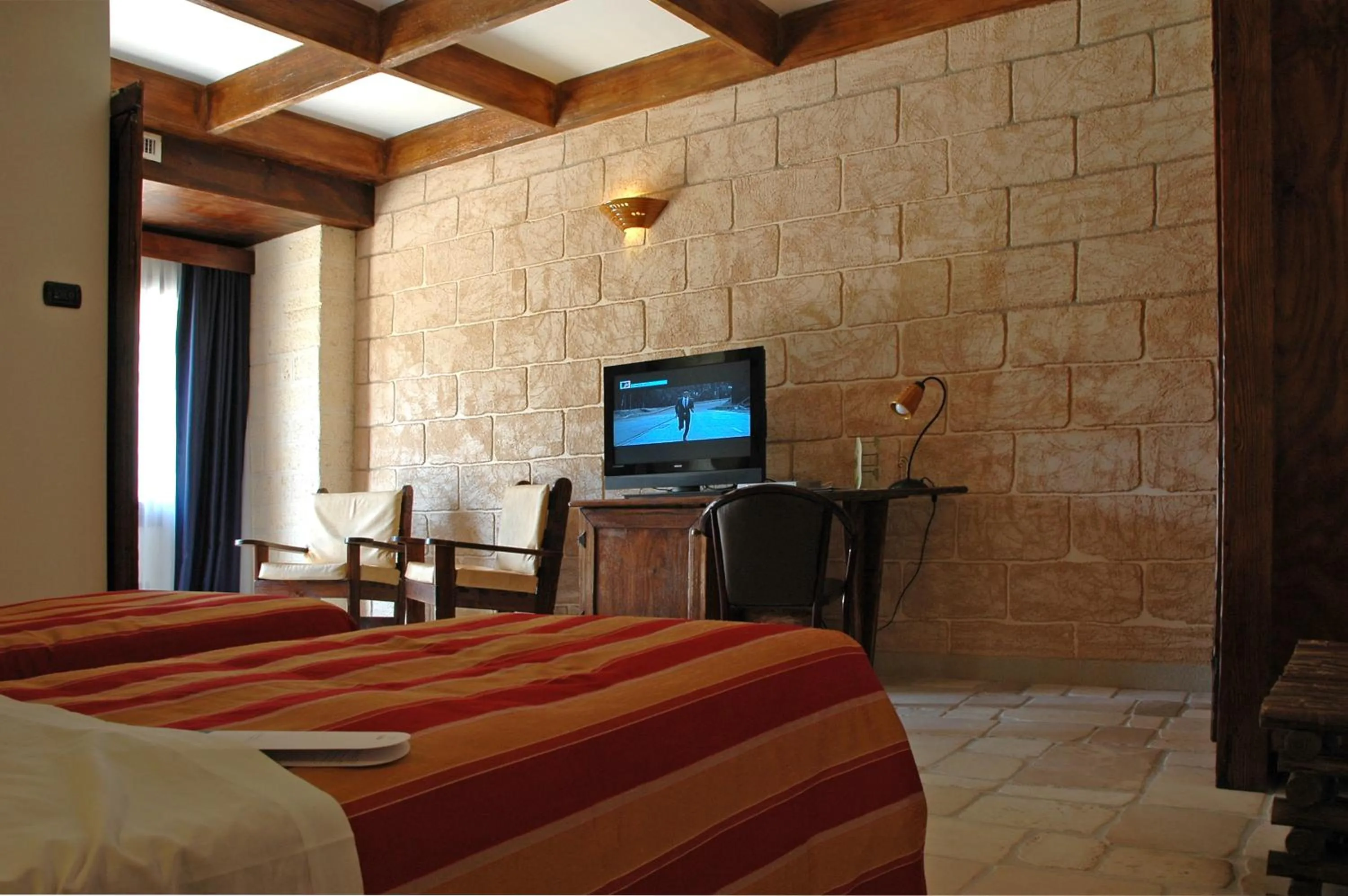 TV and multimedia, Bed in UNA HOTELS Regina Bari