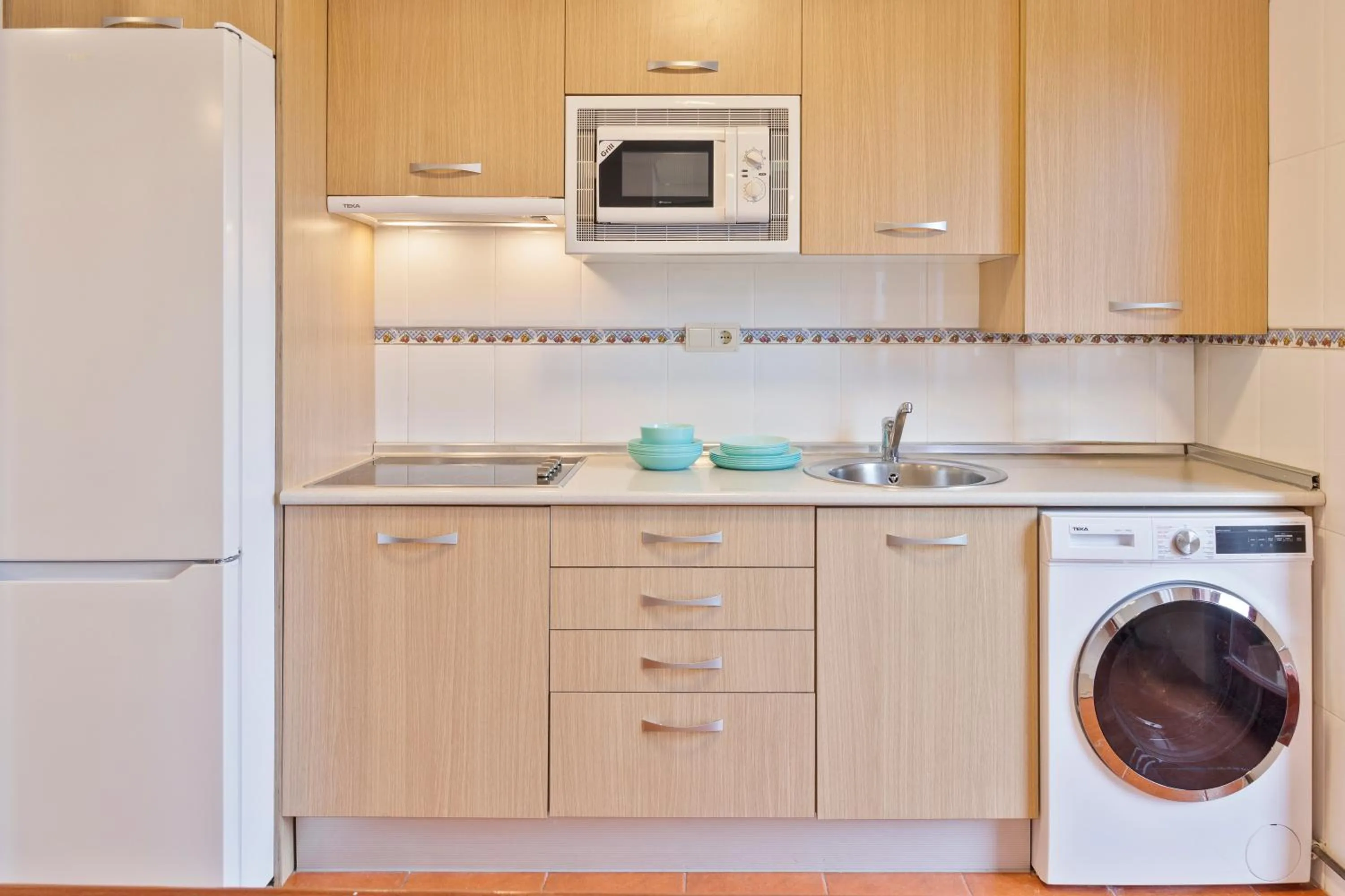 Kitchen or kitchenette in Abba Comillas Apartments