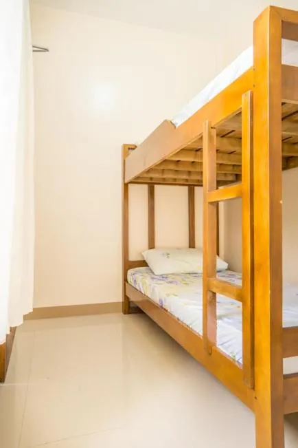 Bed in Kellocks' Seaview Apartelle