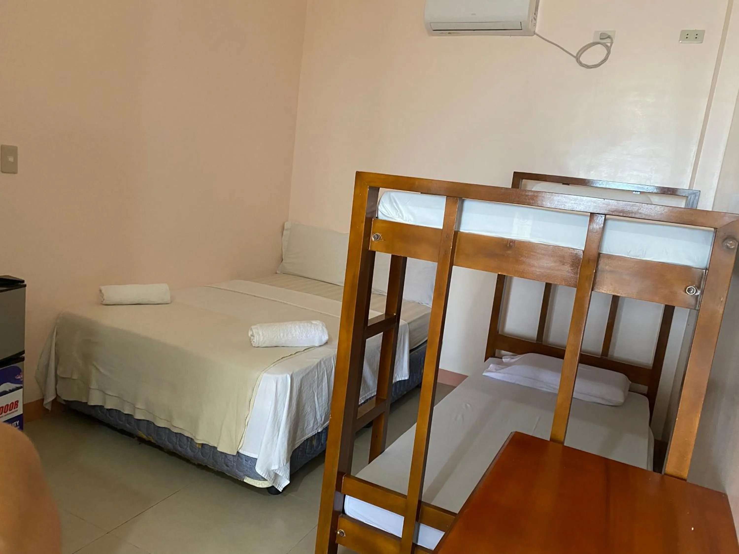 Bed in Kellocks' Seaview Apartelle