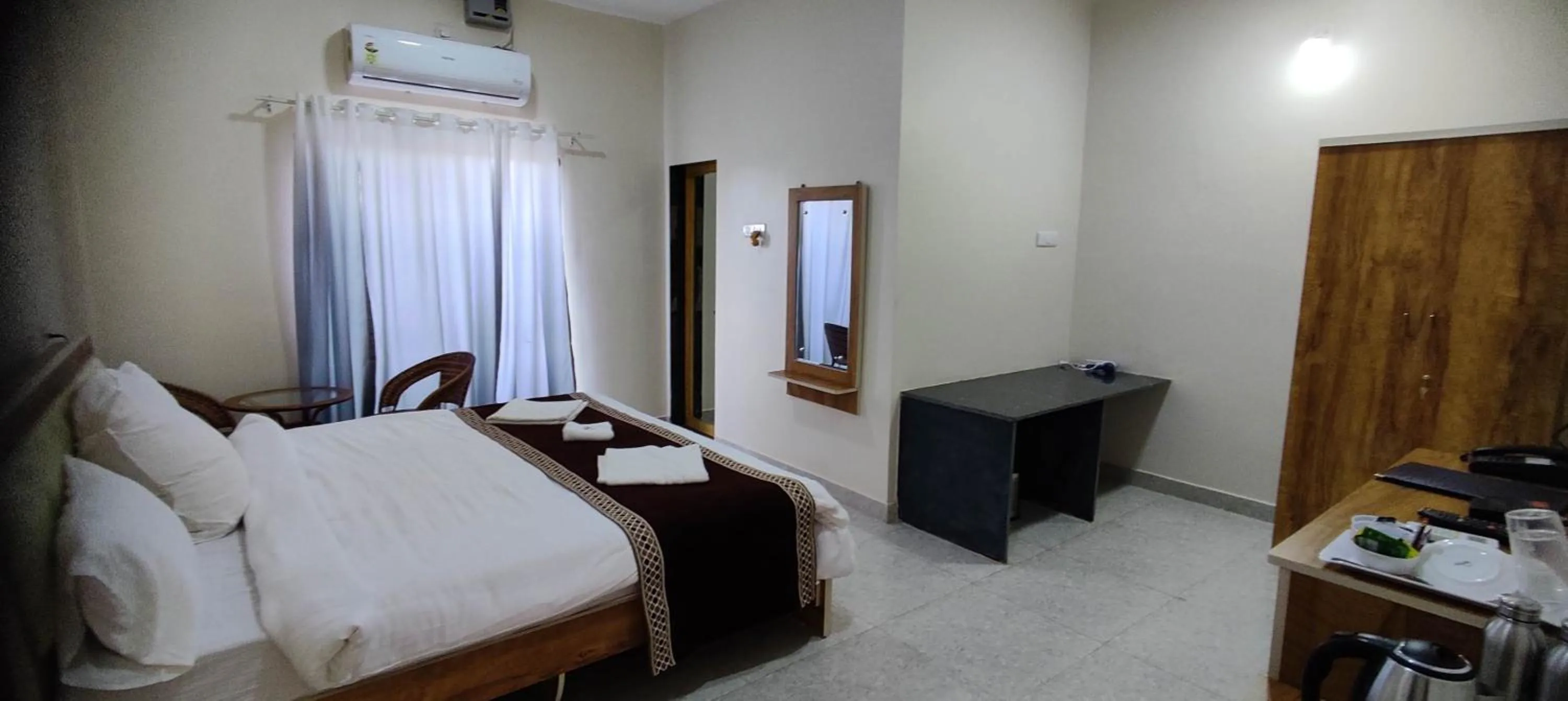 Bed in Mango Valley Resort Ganpatipule