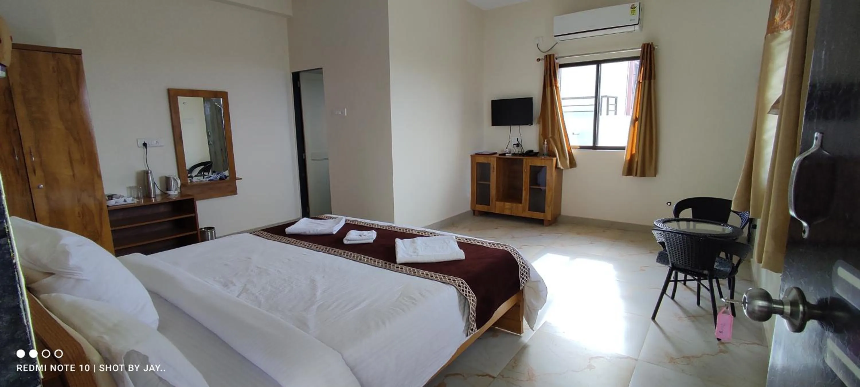 Bed in Mango Valley Resort Ganpatipule