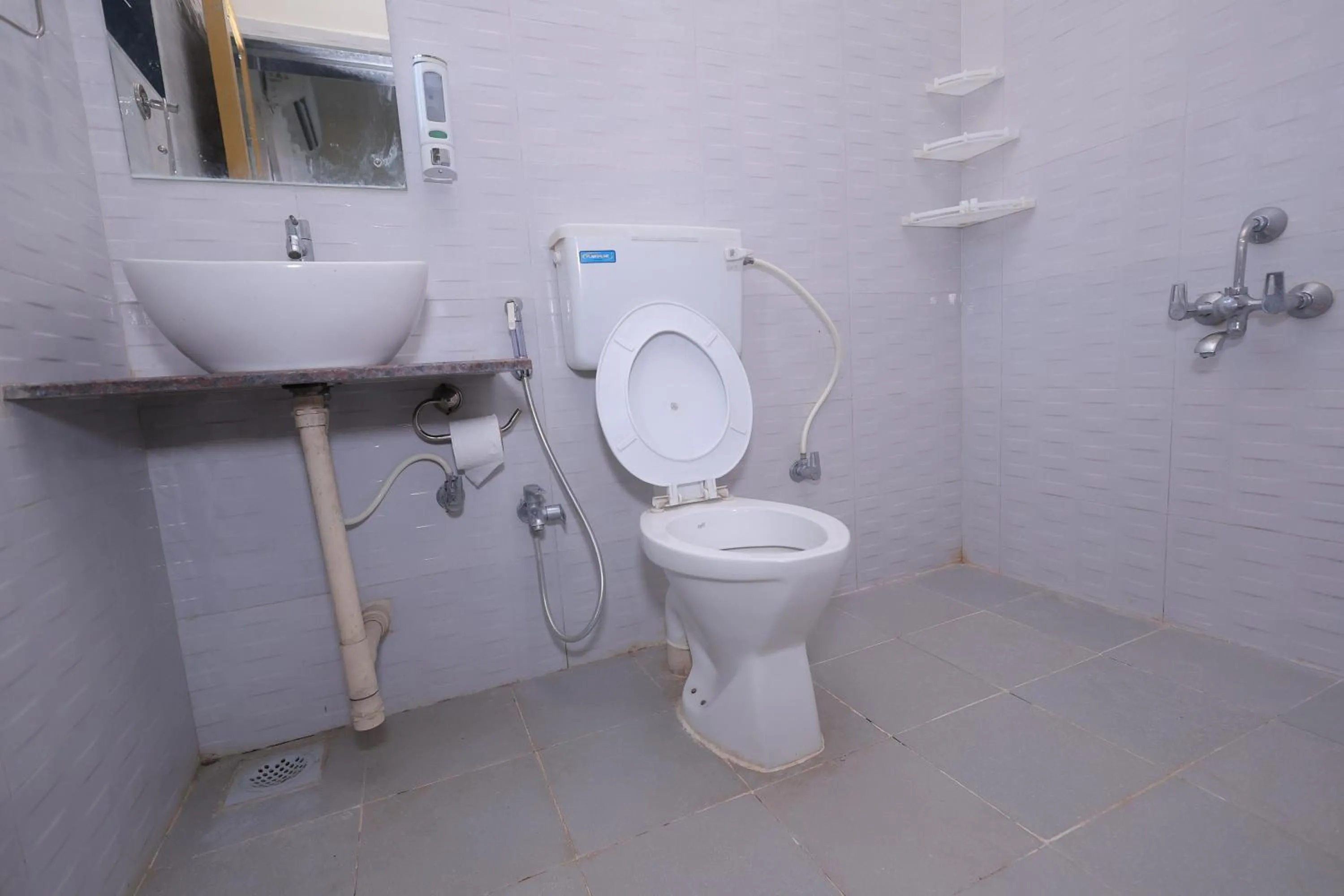 Toilet in Mango Valley Resort Ganpatipule