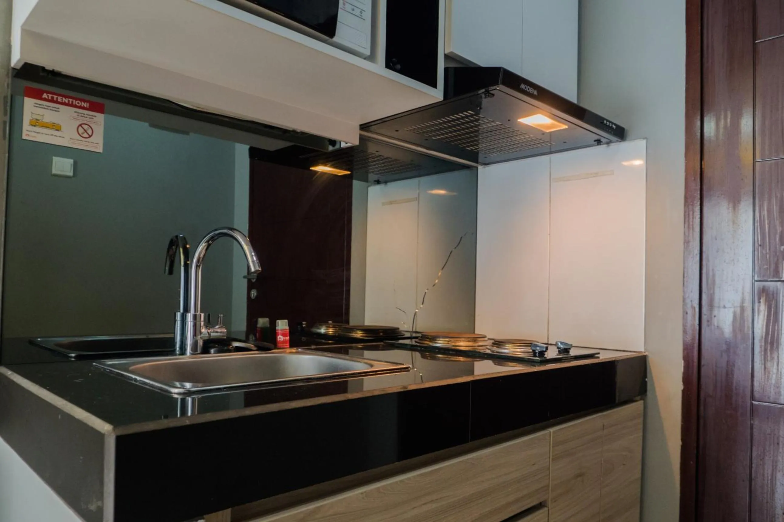 Kitchen or kitchenette in Pleasant 2BR Apartment at Gateway Pasteur By Travelio