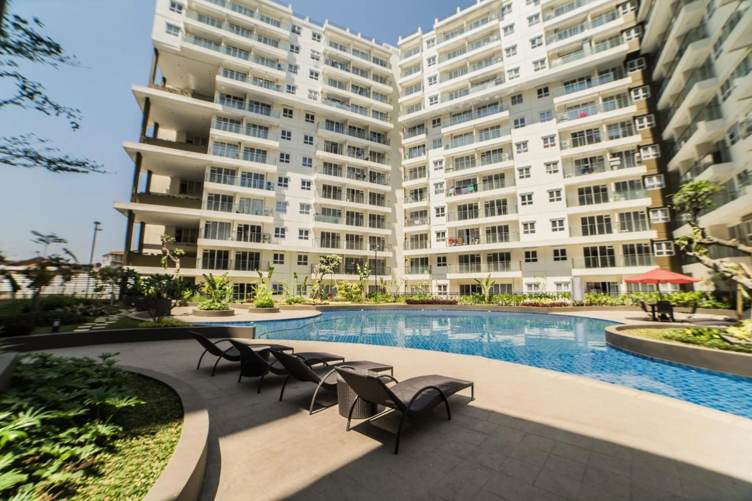Property building in Pleasant 2BR Apartment at Gateway Pasteur By Travelio