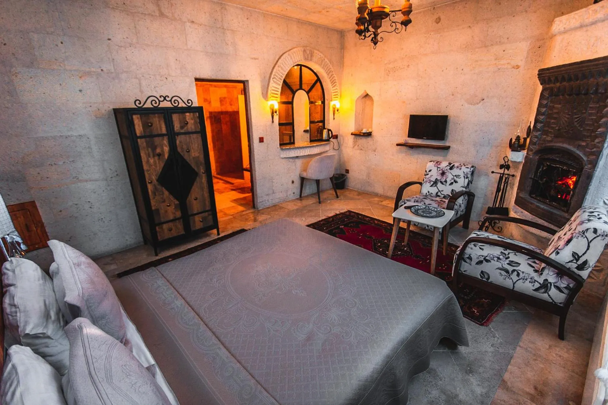 Bed in APEX CAVE HOTEL