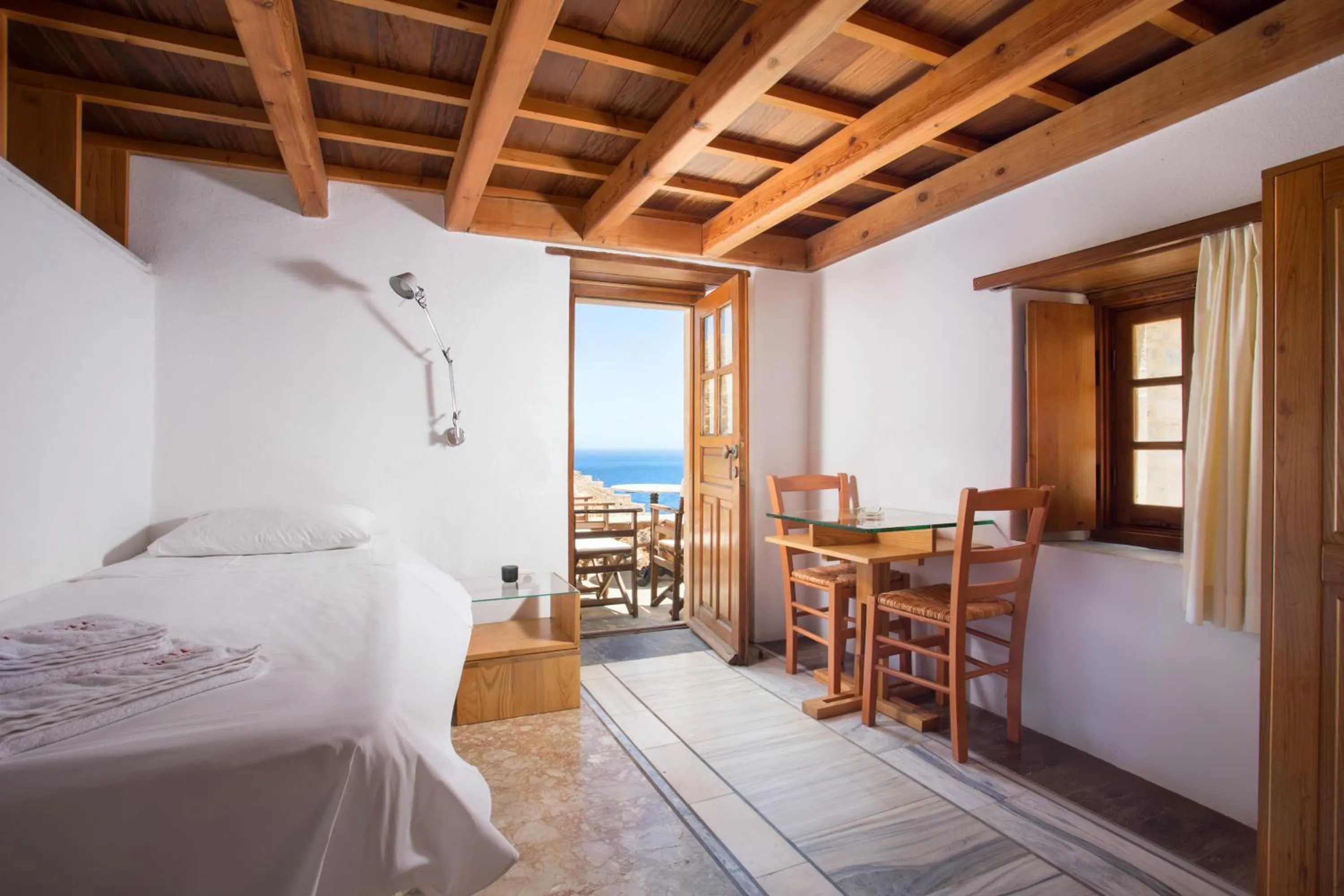 Seating area, Bed in Bastione Malvasia Hotel (ex New Malvasia)