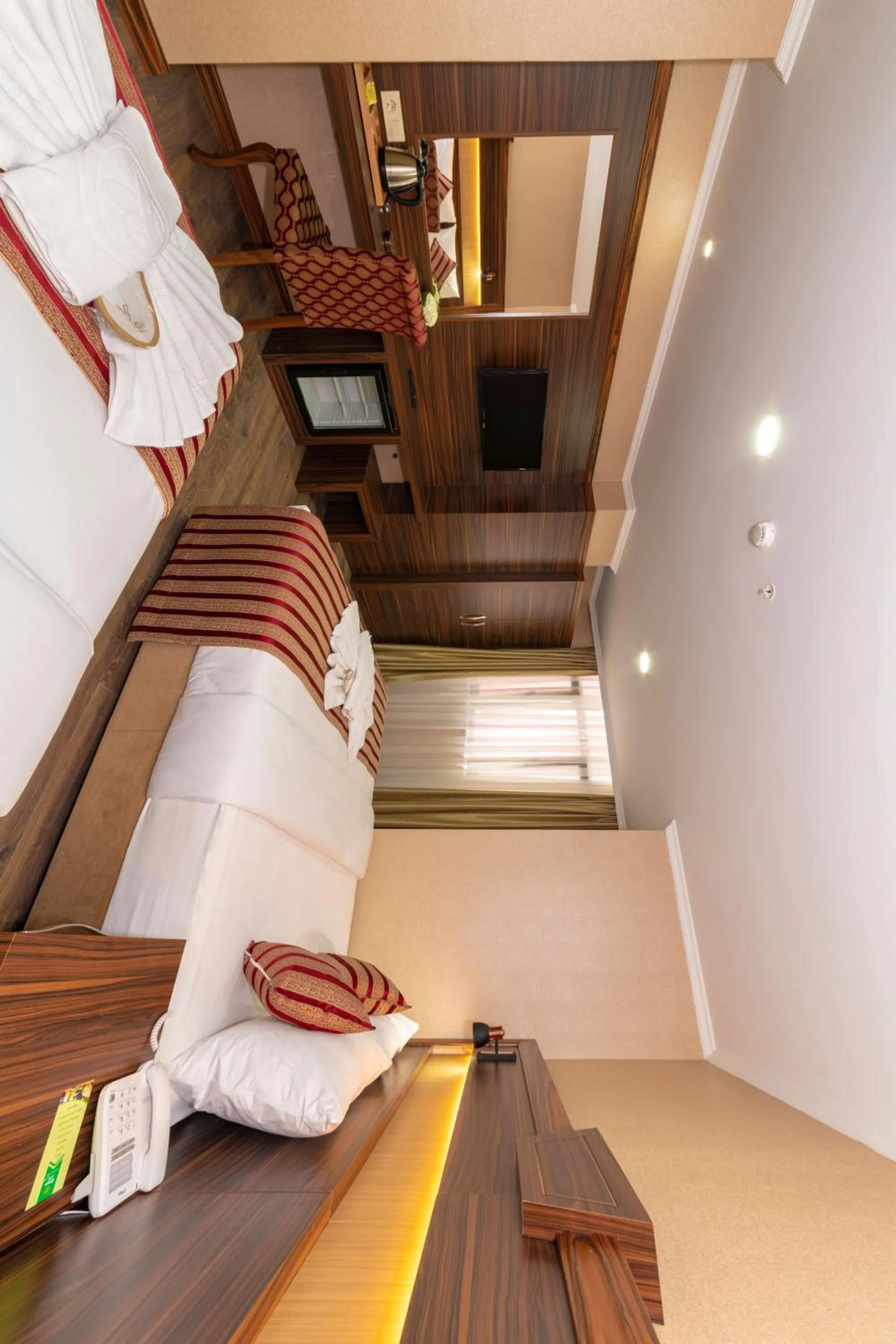 Bed in Vision Deluxe Hotel