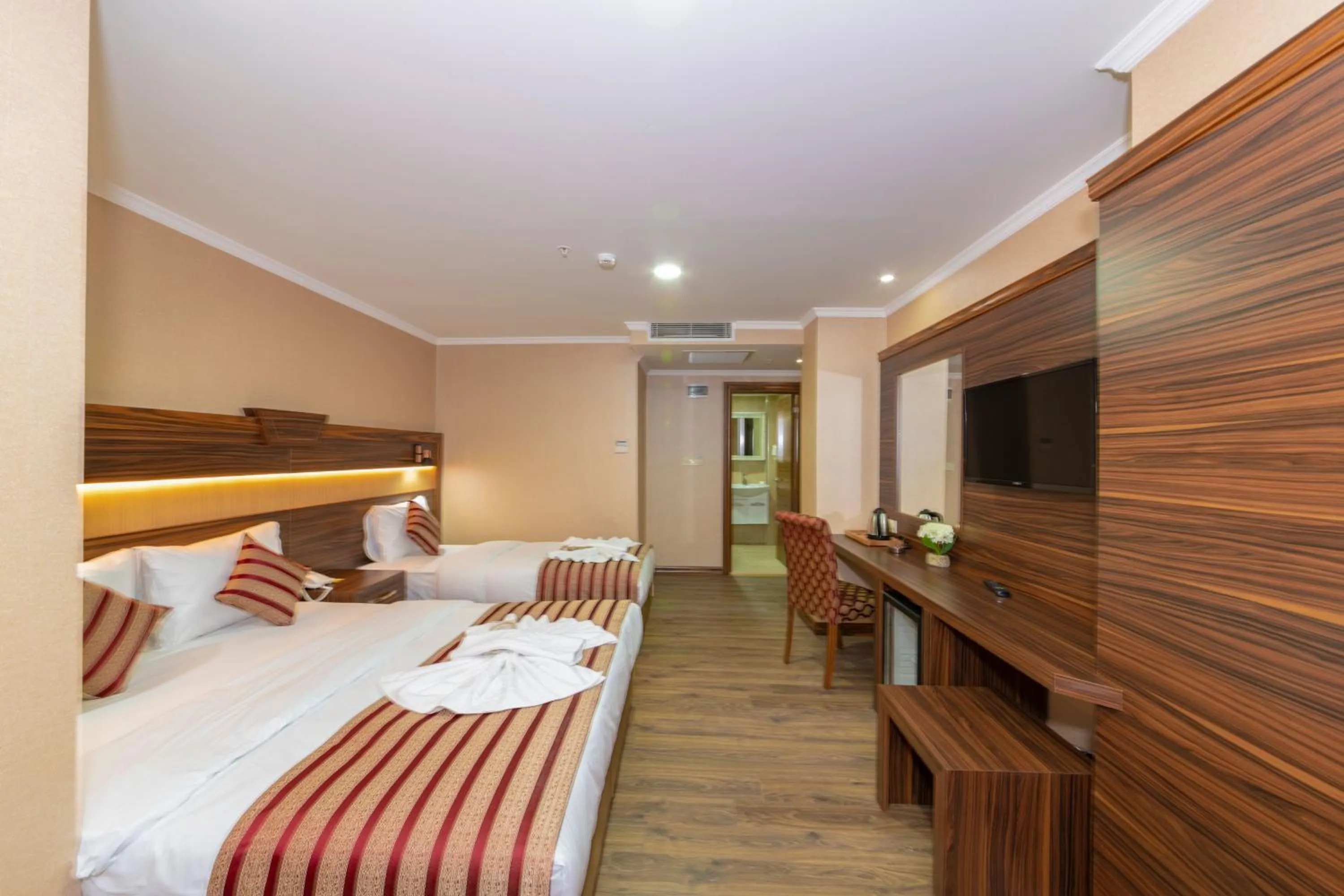 Bed in Vision Deluxe Hotel