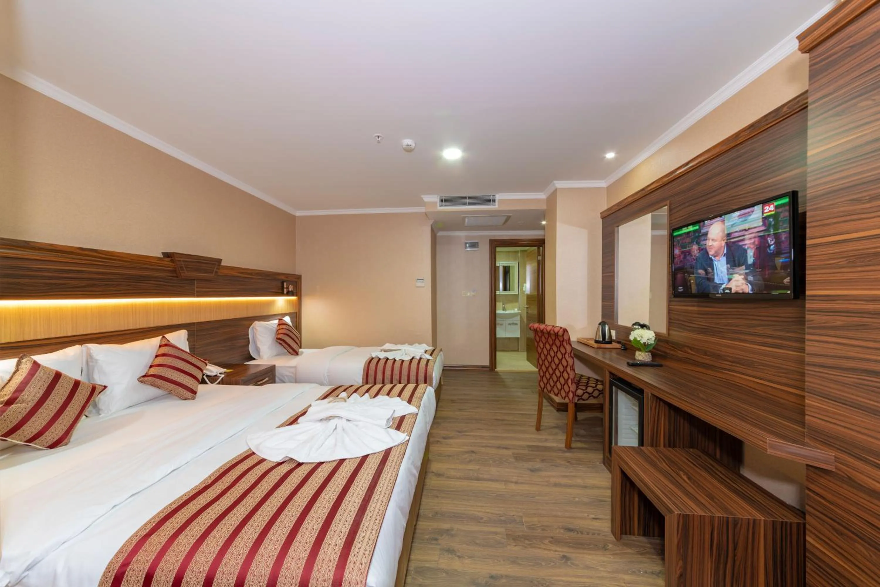 Bed in Vision Deluxe Hotel