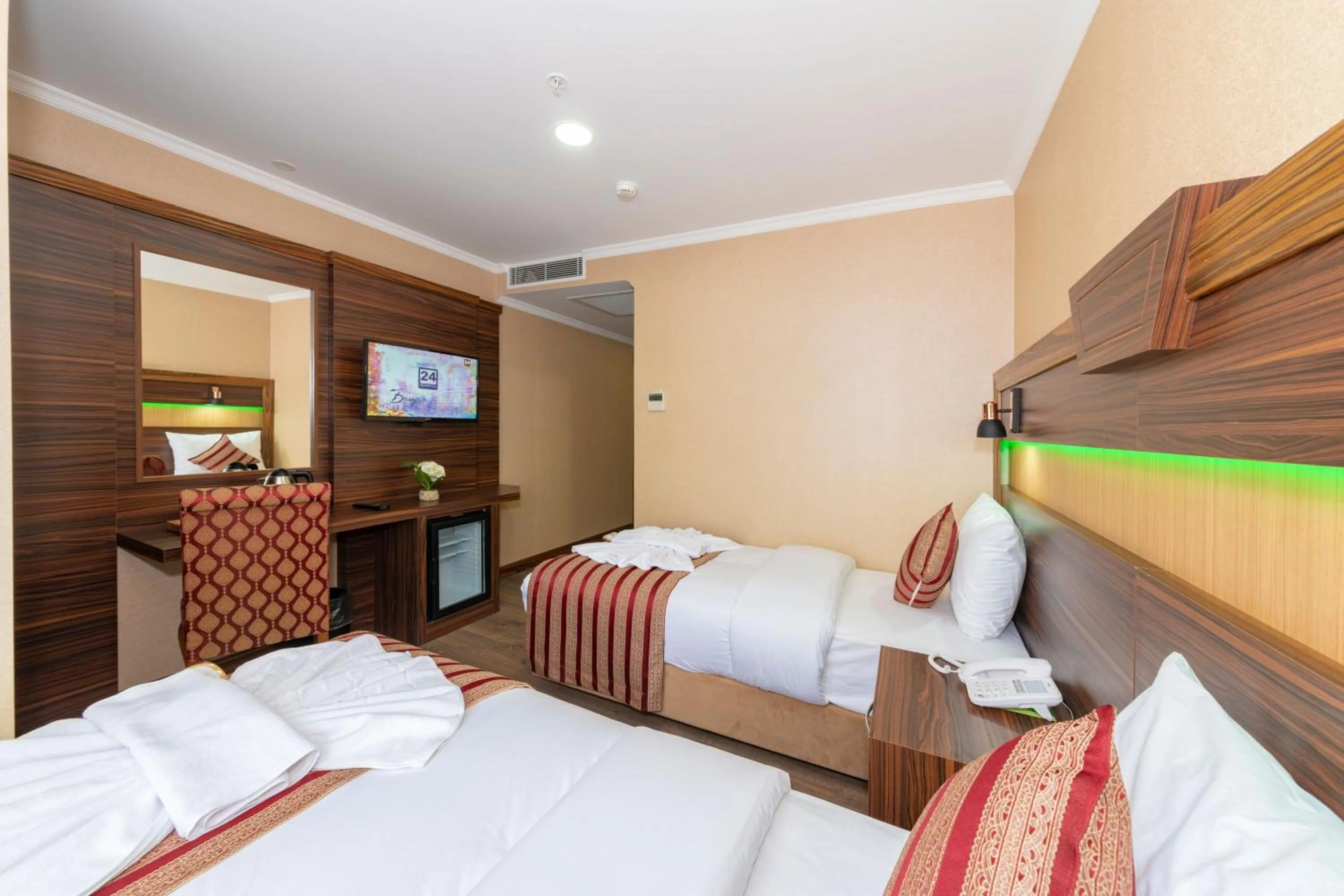 Bed in Vision Deluxe Hotel