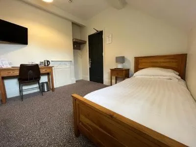 Bed in Woodcote Hotel