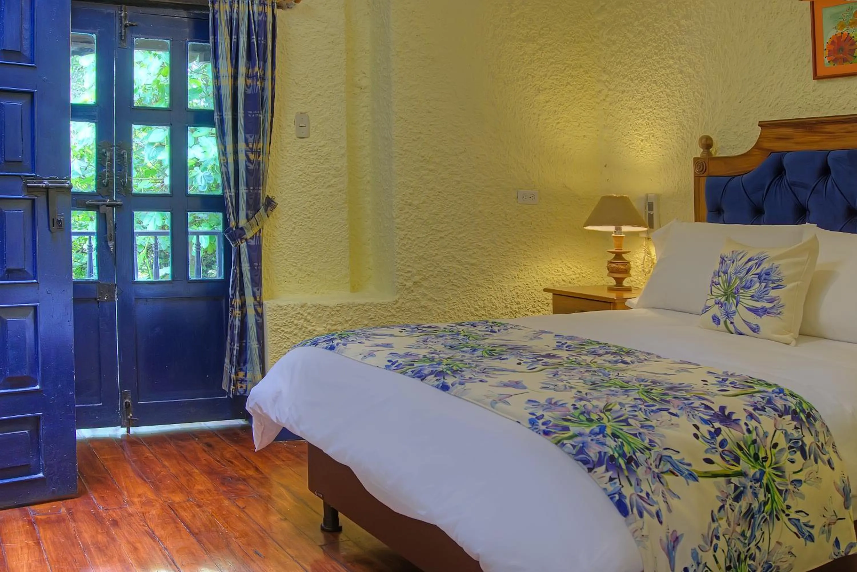 Bed in Hostería Hacienda Pinsaqui