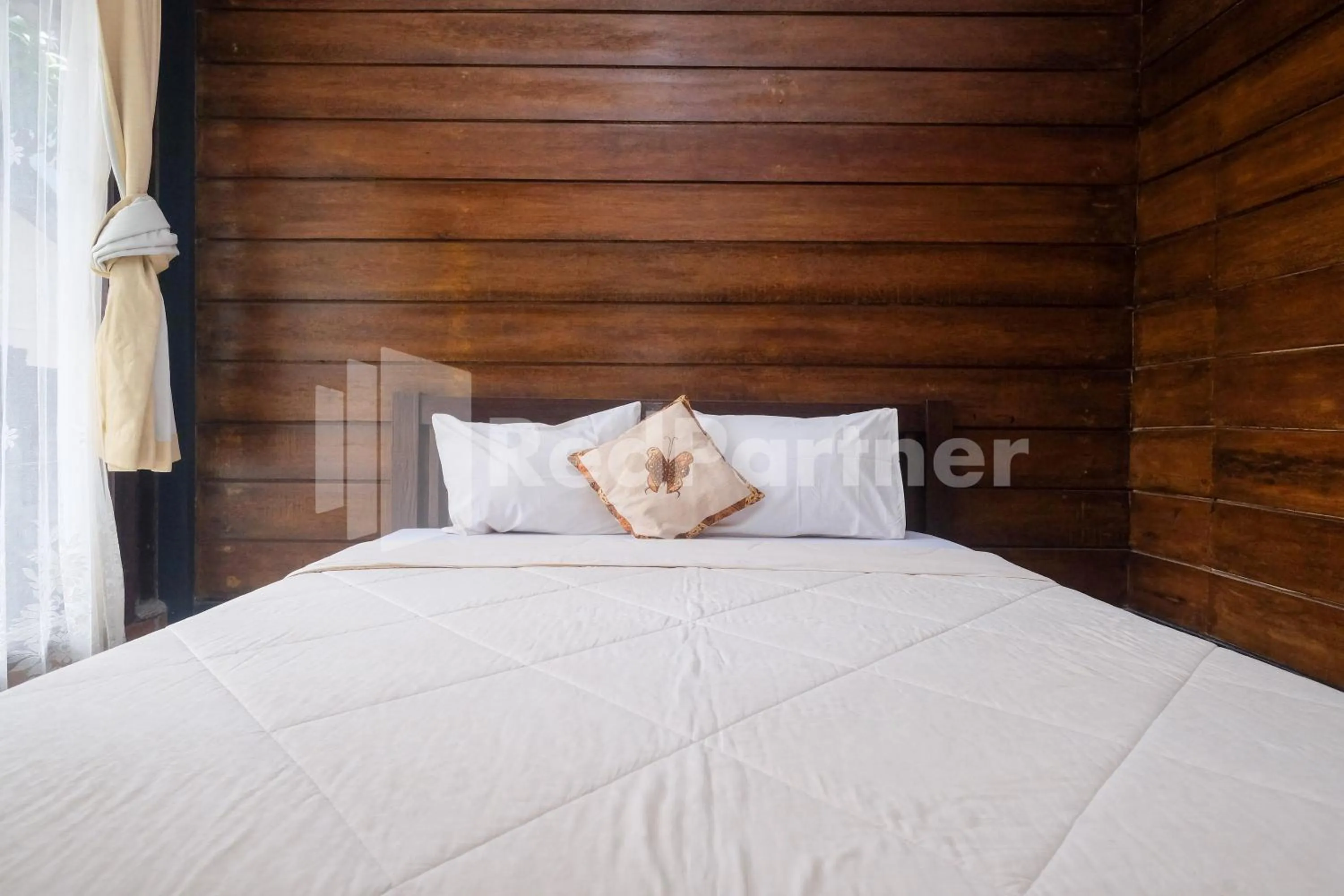 Bed in Kebon Krapyak Cottage Syariah Mitra RedDoorz near Stadion Maguwoharjo