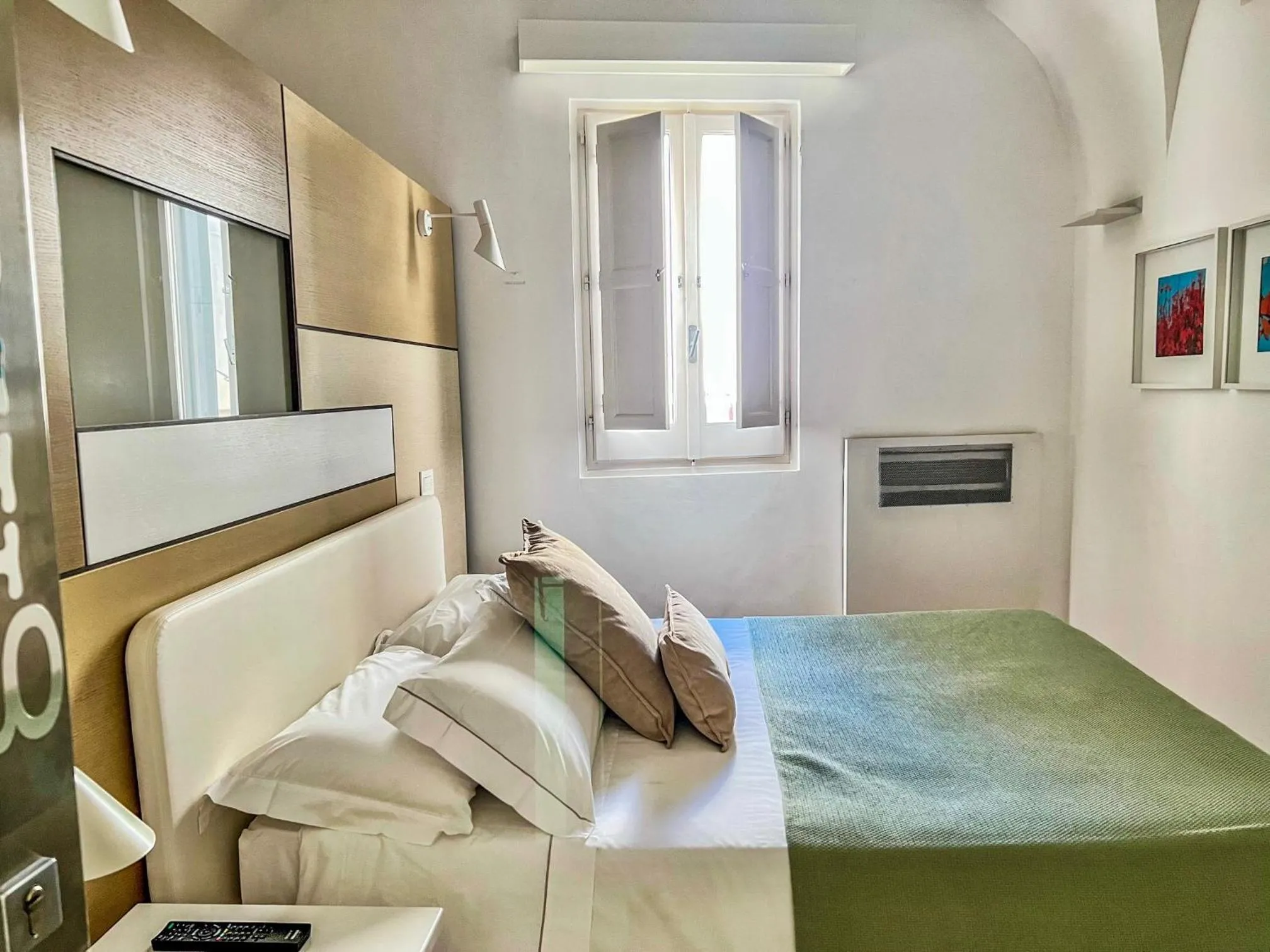 Bed in Santacroce Luxury Rooms