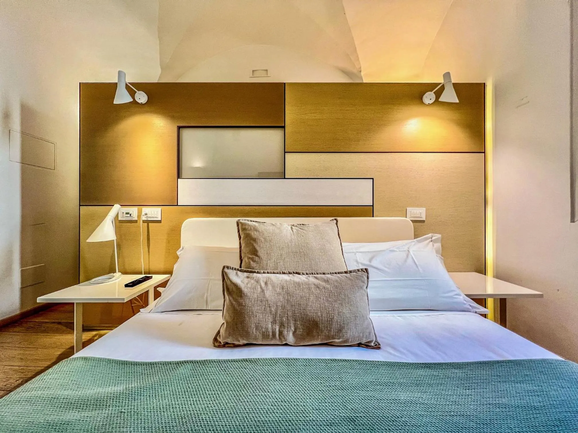 Bed in Santacroce Luxury Rooms