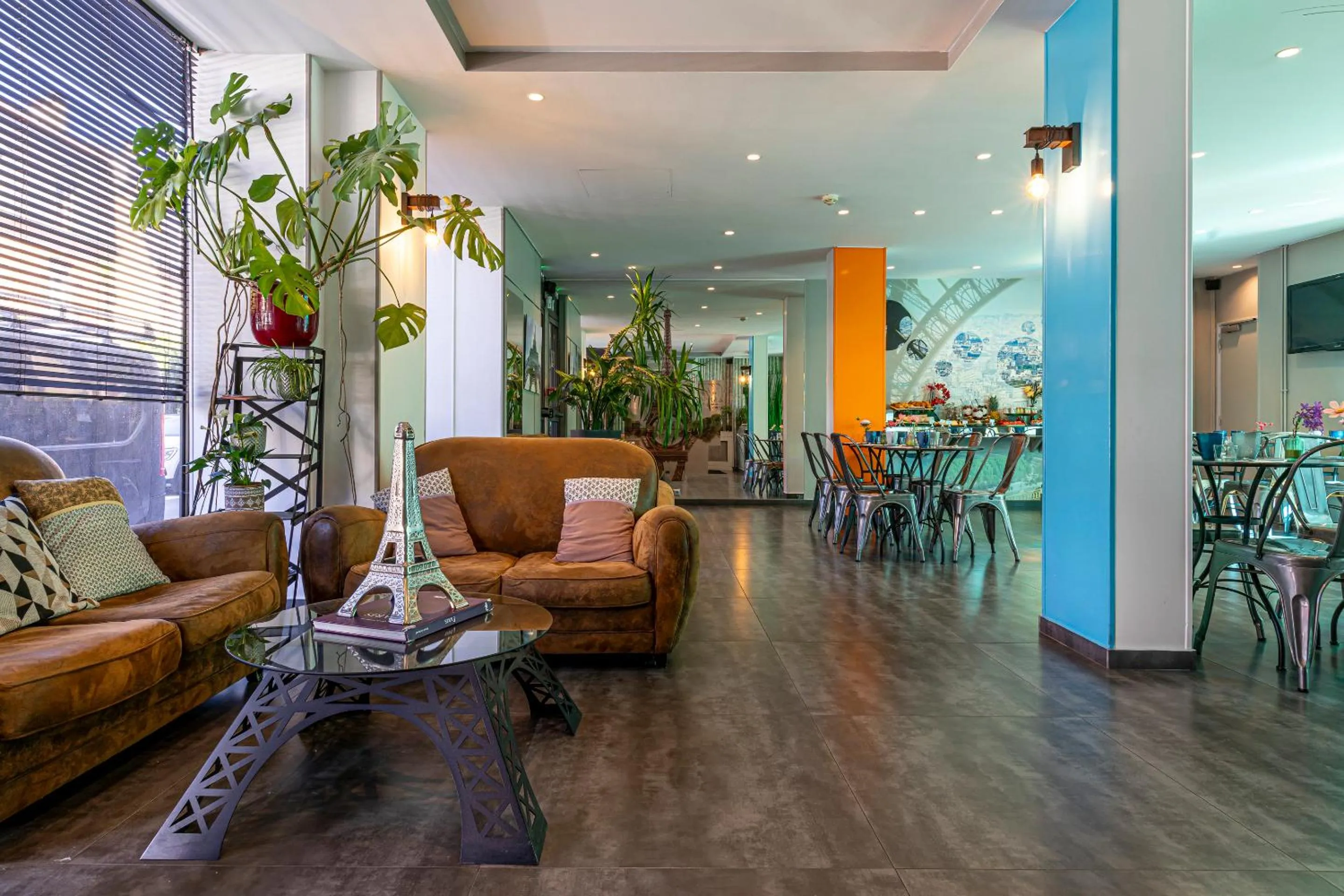 Communal lounge/ TV room in Hotel Alpha Paris Eiffel by Patrick Hayat