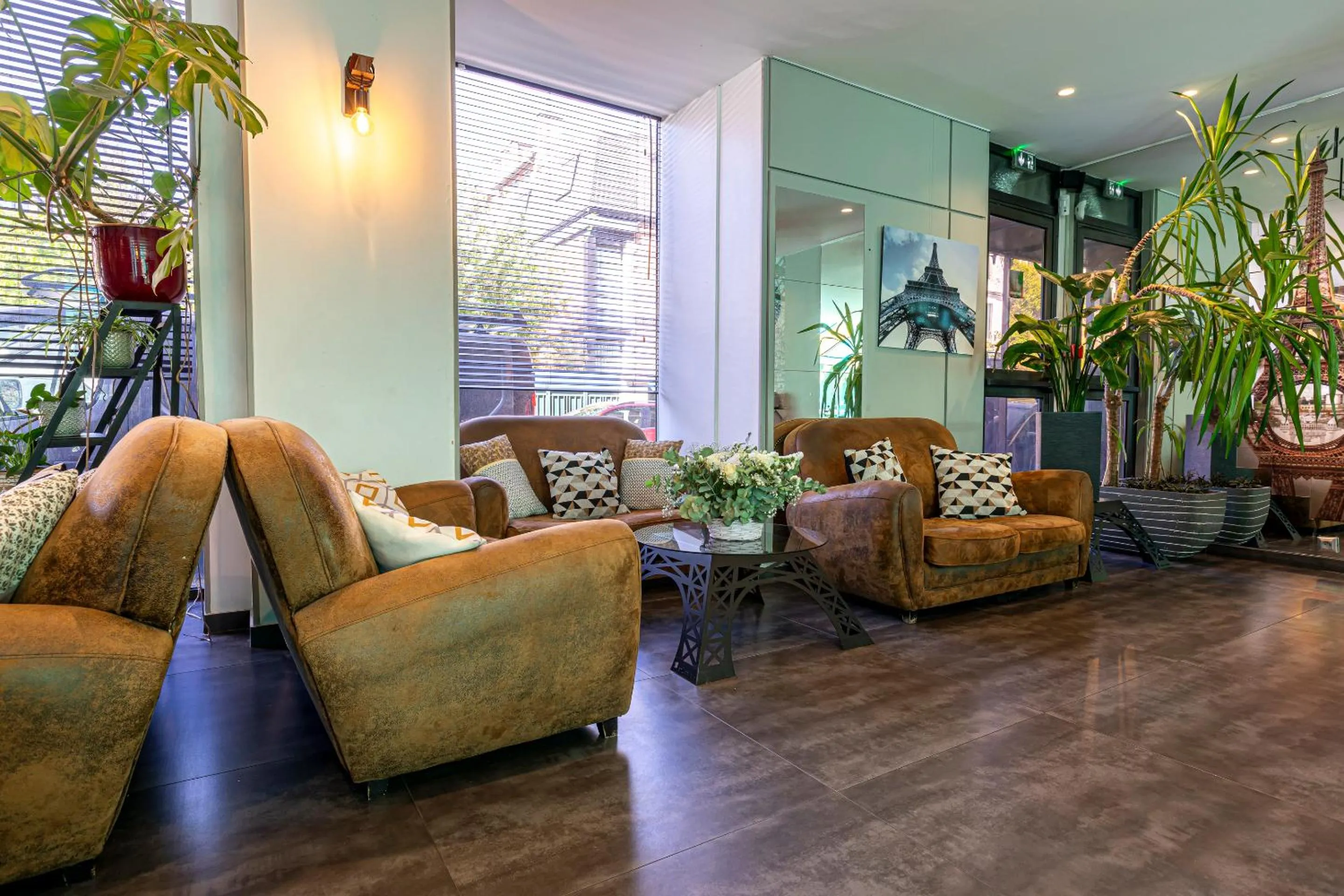 Communal lounge/ TV room in Hotel Alpha Paris Eiffel by Patrick Hayat