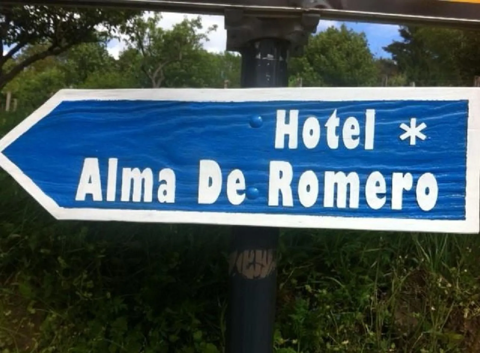 Property logo or sign in Hotel Alma de Romero