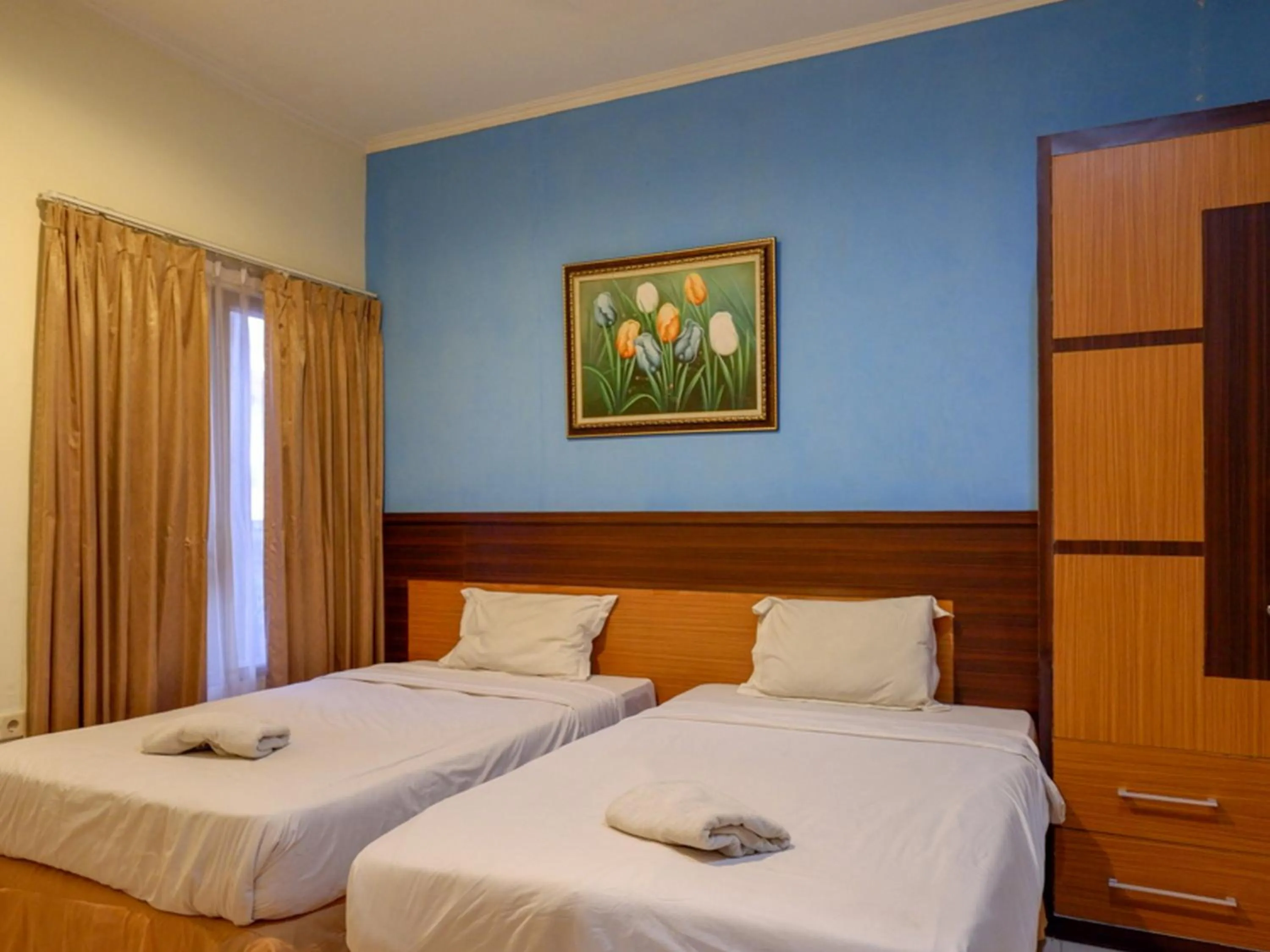 Bed in Pineapple Mansion Solo Mitra RedDoorz near RS JIH Solo