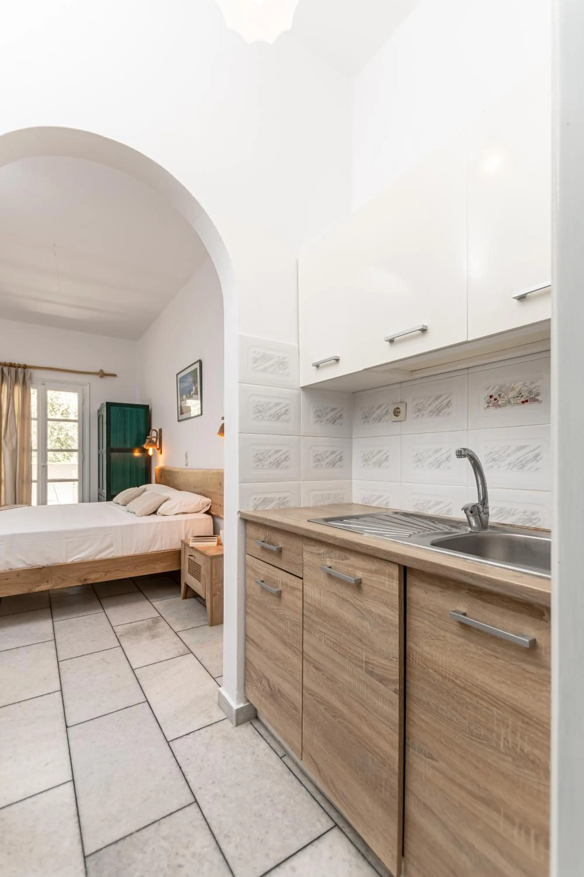 kitchen, Bed in Studios Vrettos Beachfront Hotel