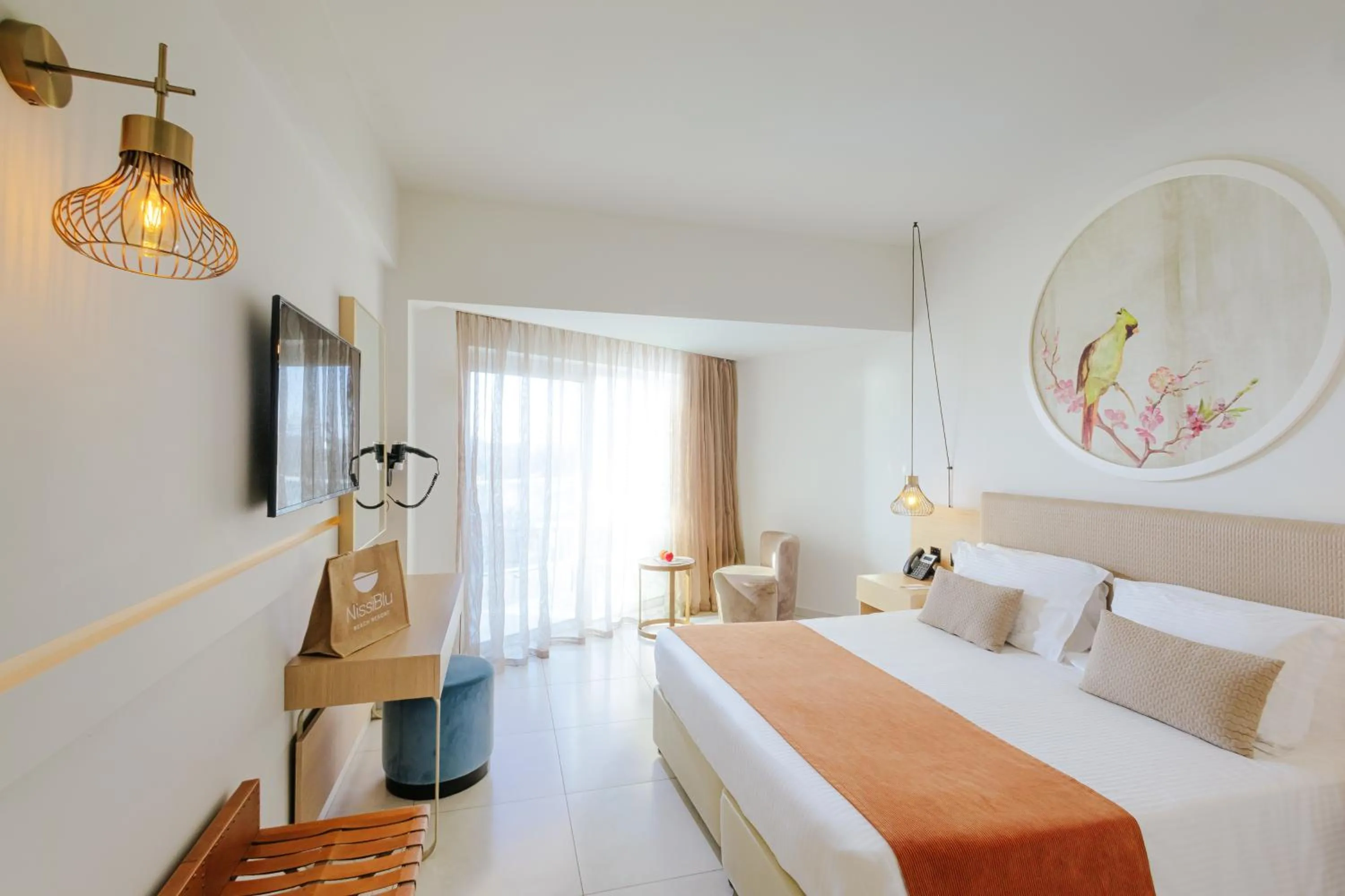 Bed in NissiBlu Beach Resort