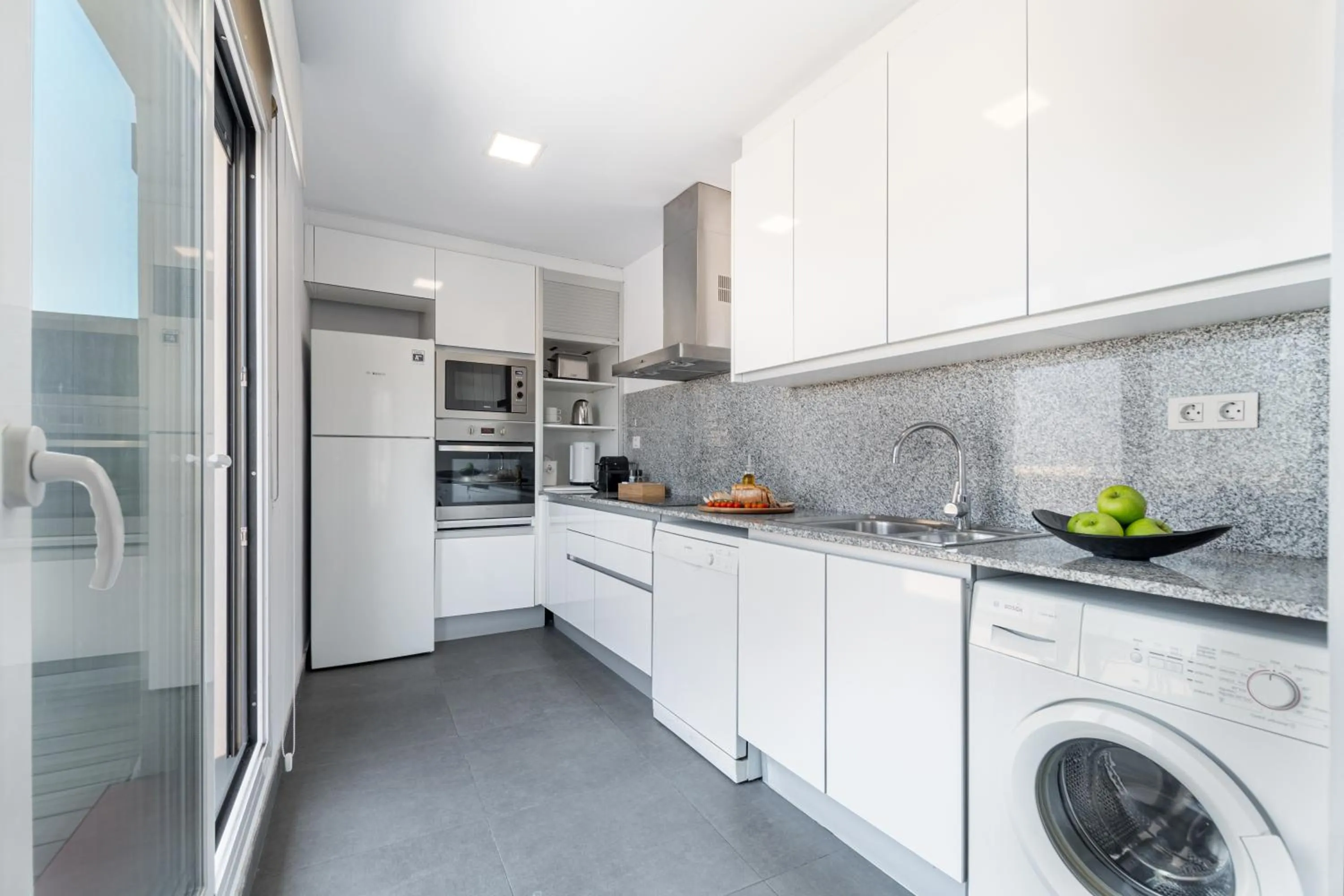 Kitchen or kitchenette in The Corner Apartments by Aspasios