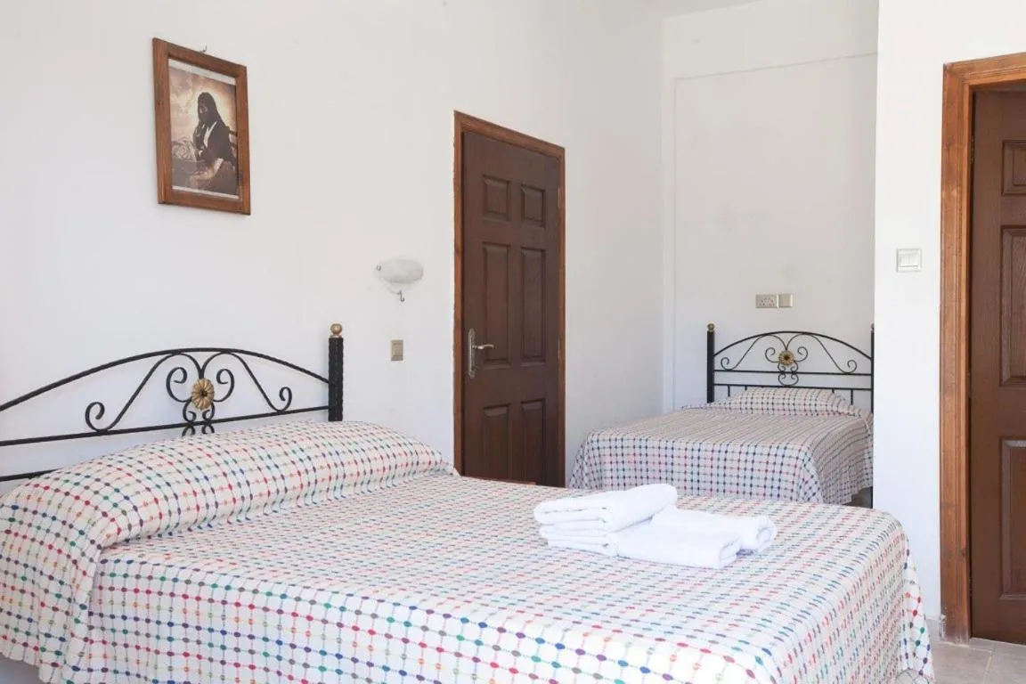 Bed in Glaro Garden Hotel