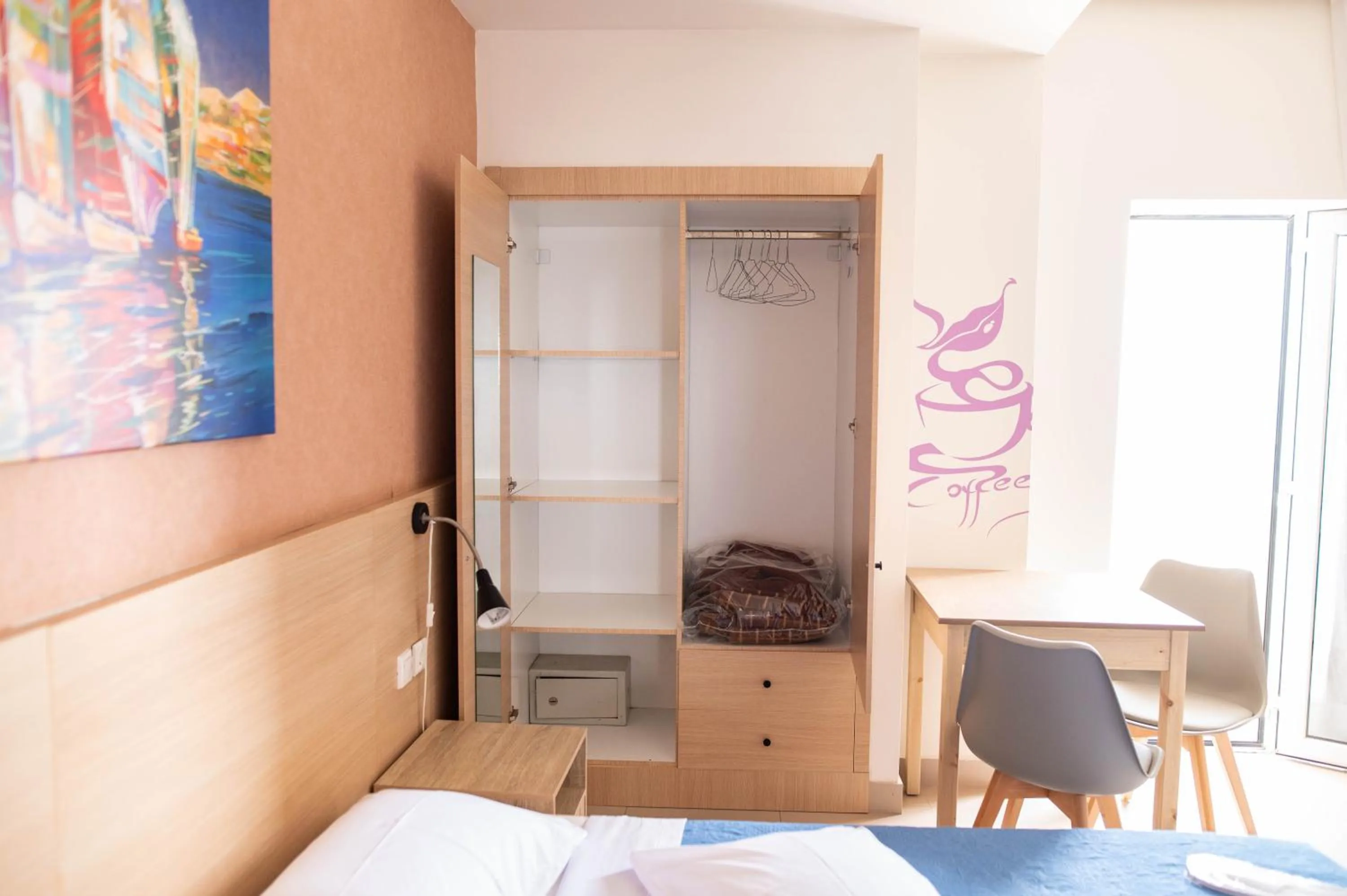 Bed in Achilleas Hotel Apartments