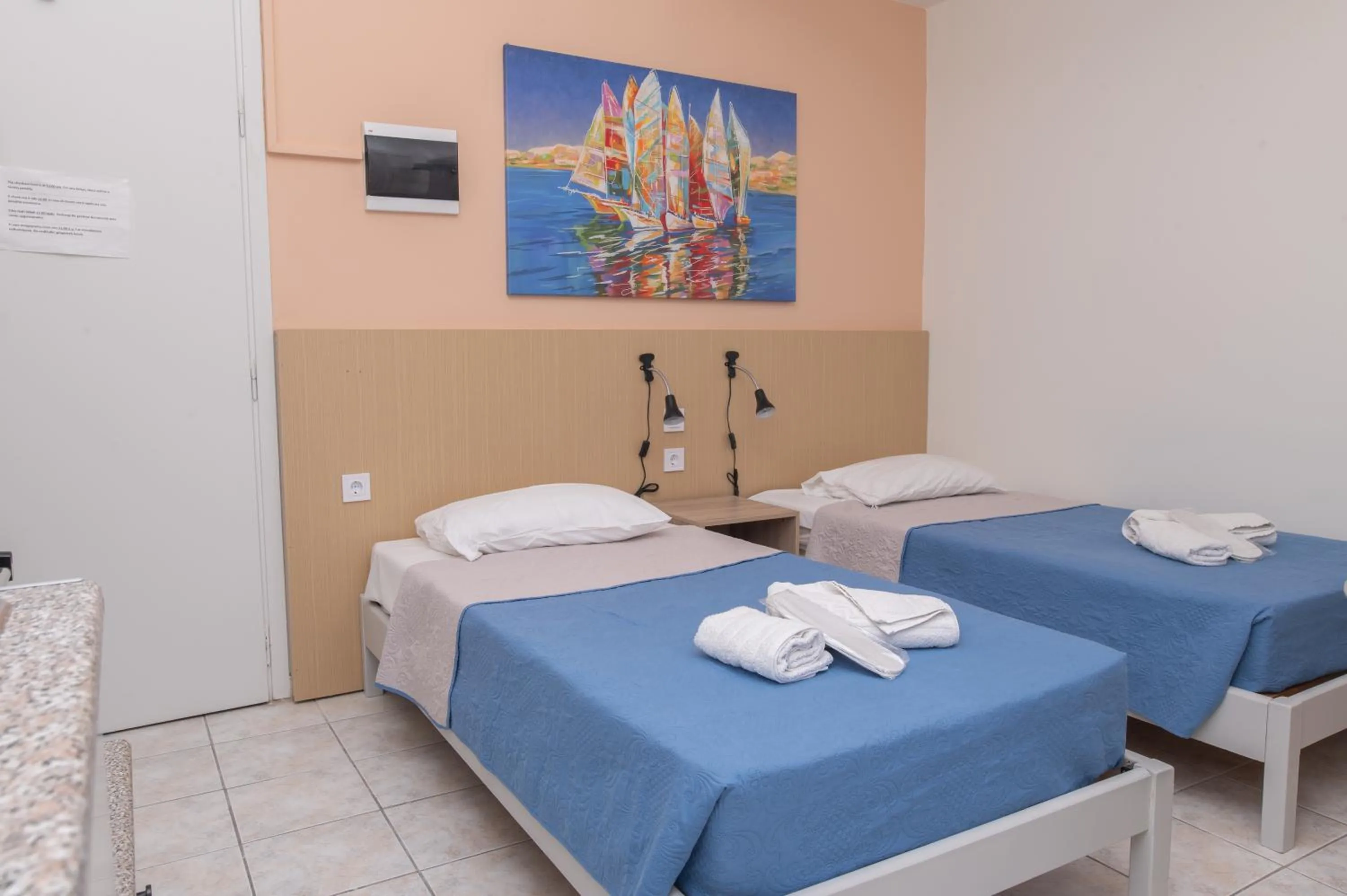 Bed in Achilleas Hotel Apartments