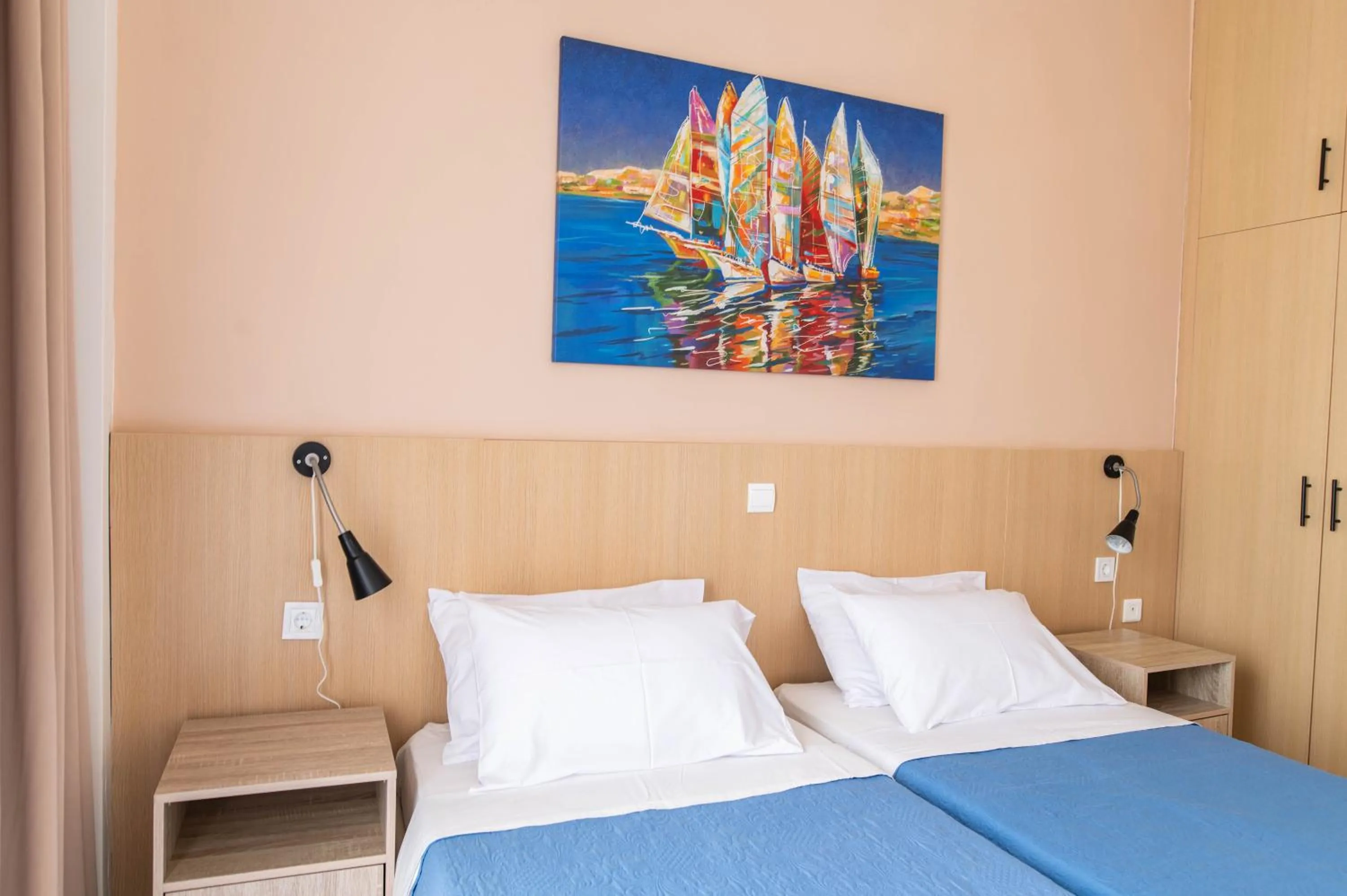 Bed in Achilleas Hotel Apartments