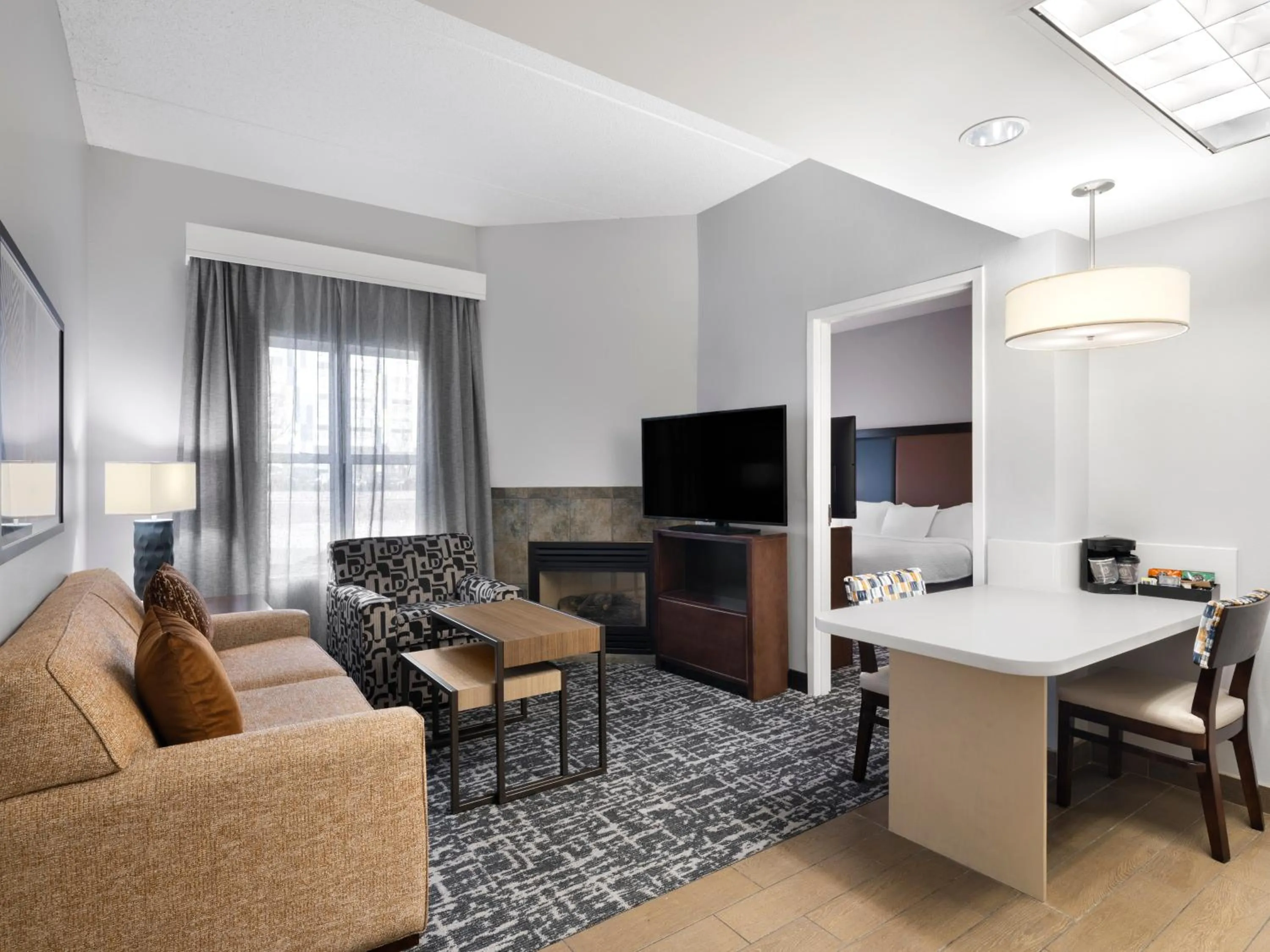 Communal lounge/ TV room in Homewood Suites Columbus - Airport