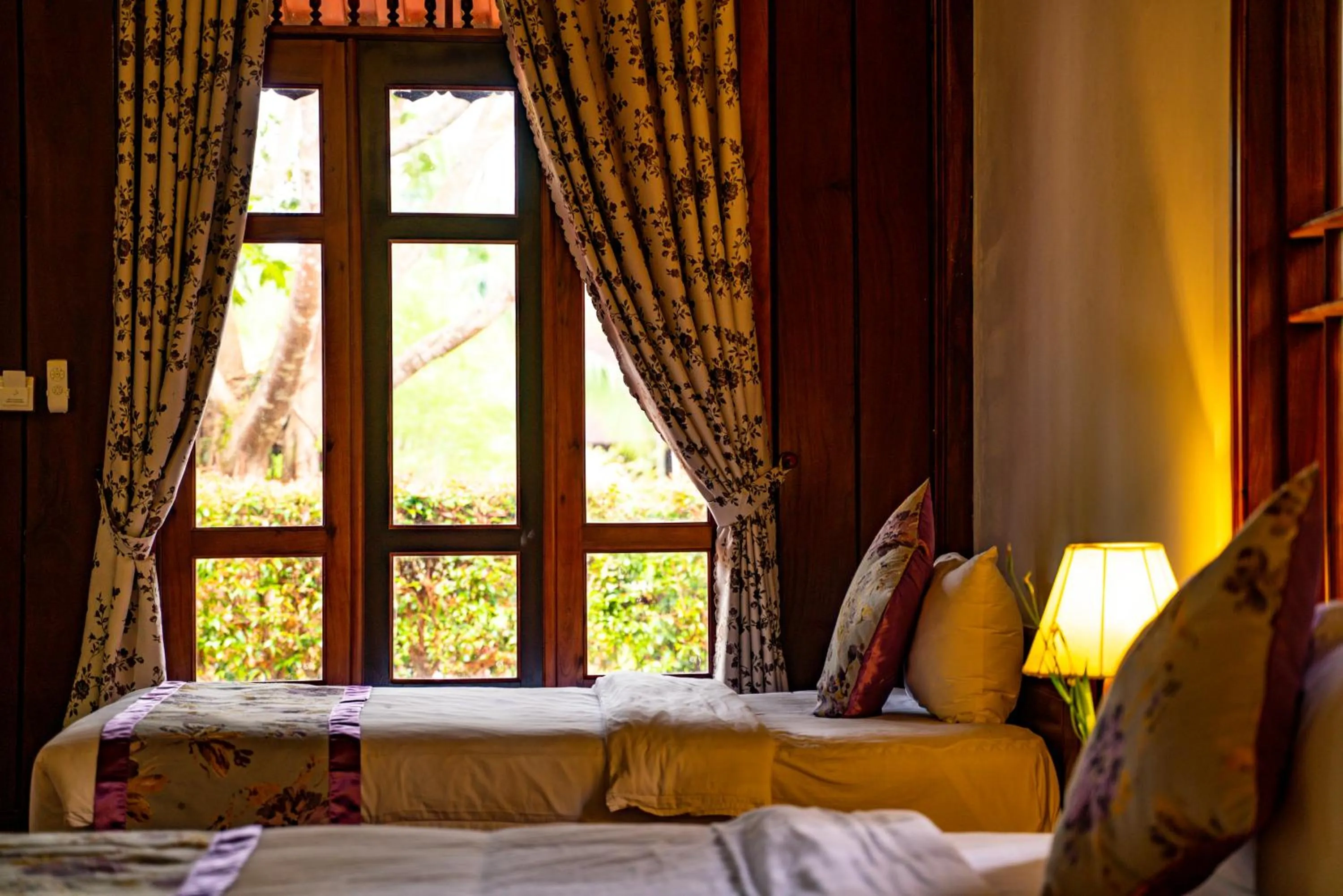 Bed in Maison Du VietNam Resort & Spa