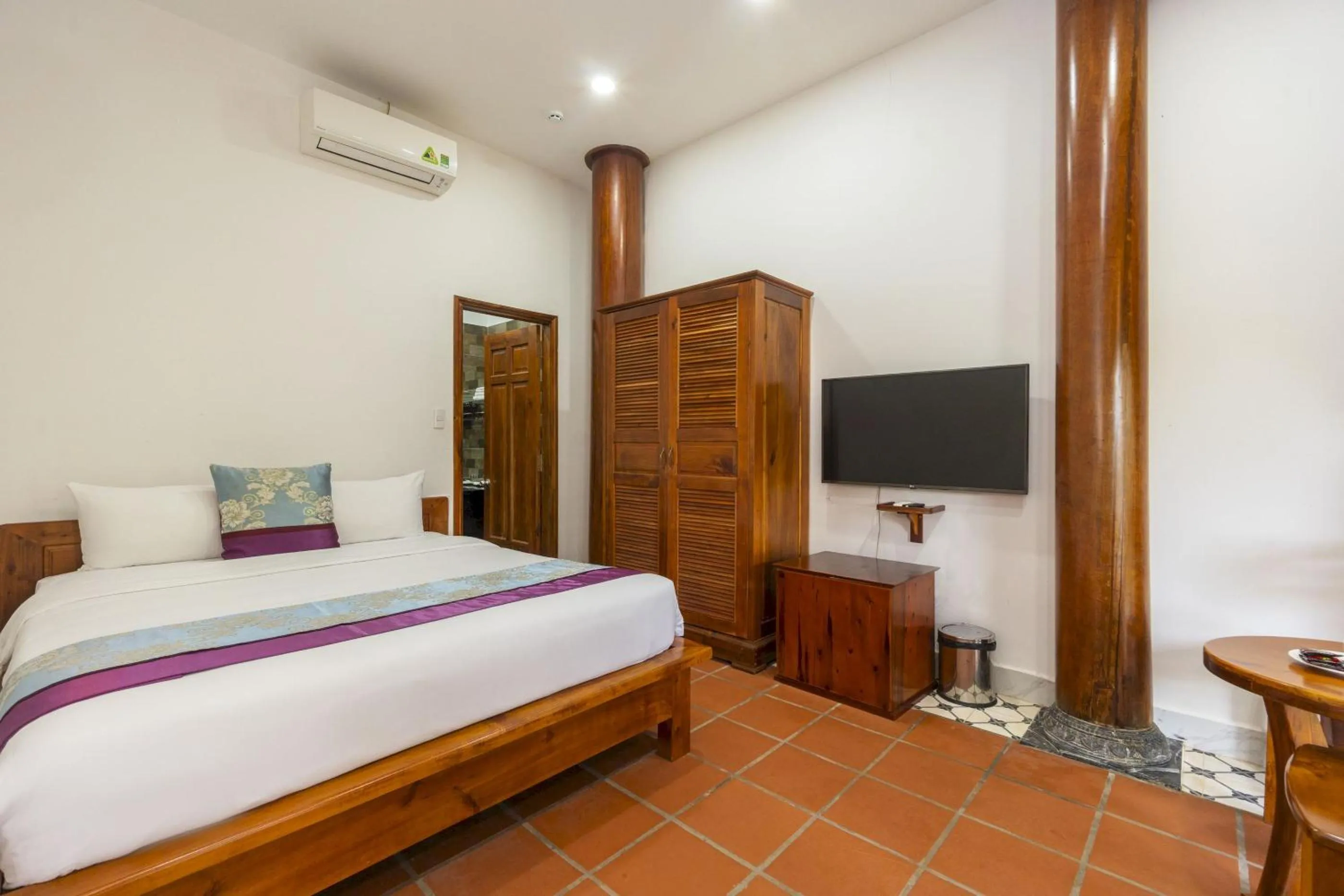 Bed in Maison Du VietNam Resort & Spa