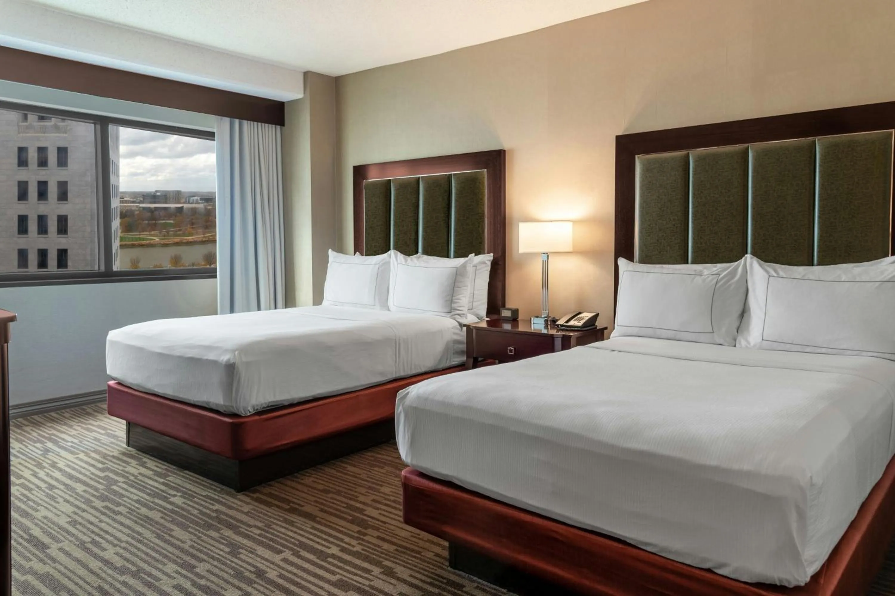 Photo of the whole room, Bed in The Capital Suites Hotel