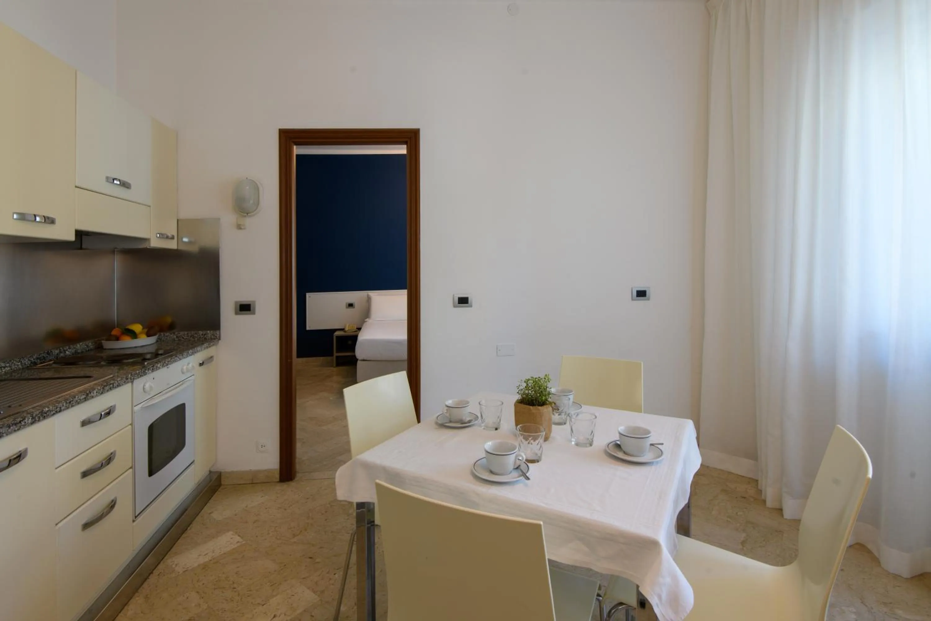 Kitchen or kitchenette in Hotel & Apartments Sasso