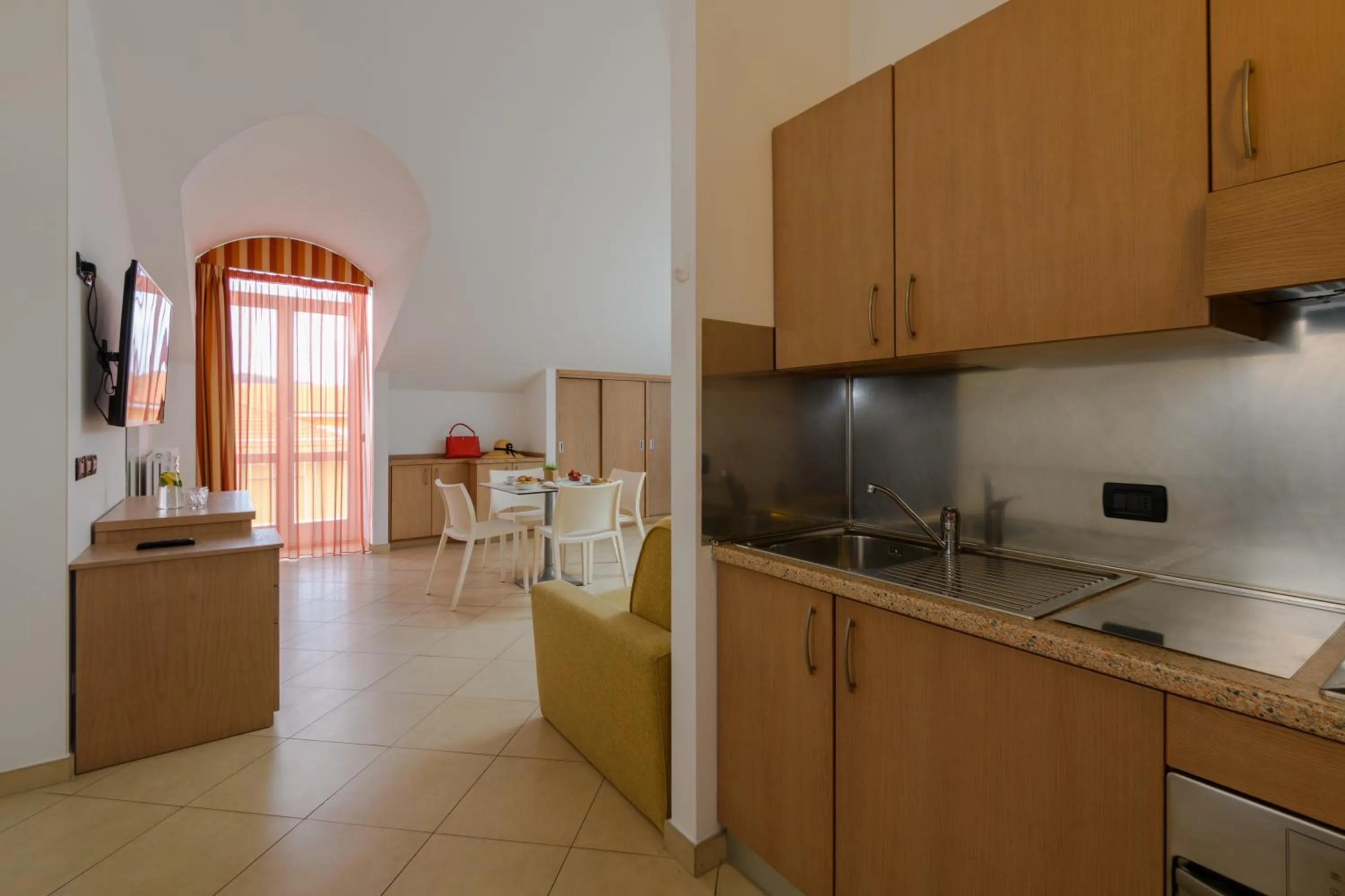 Kitchen or kitchenette in Hotel & Apartments Sasso