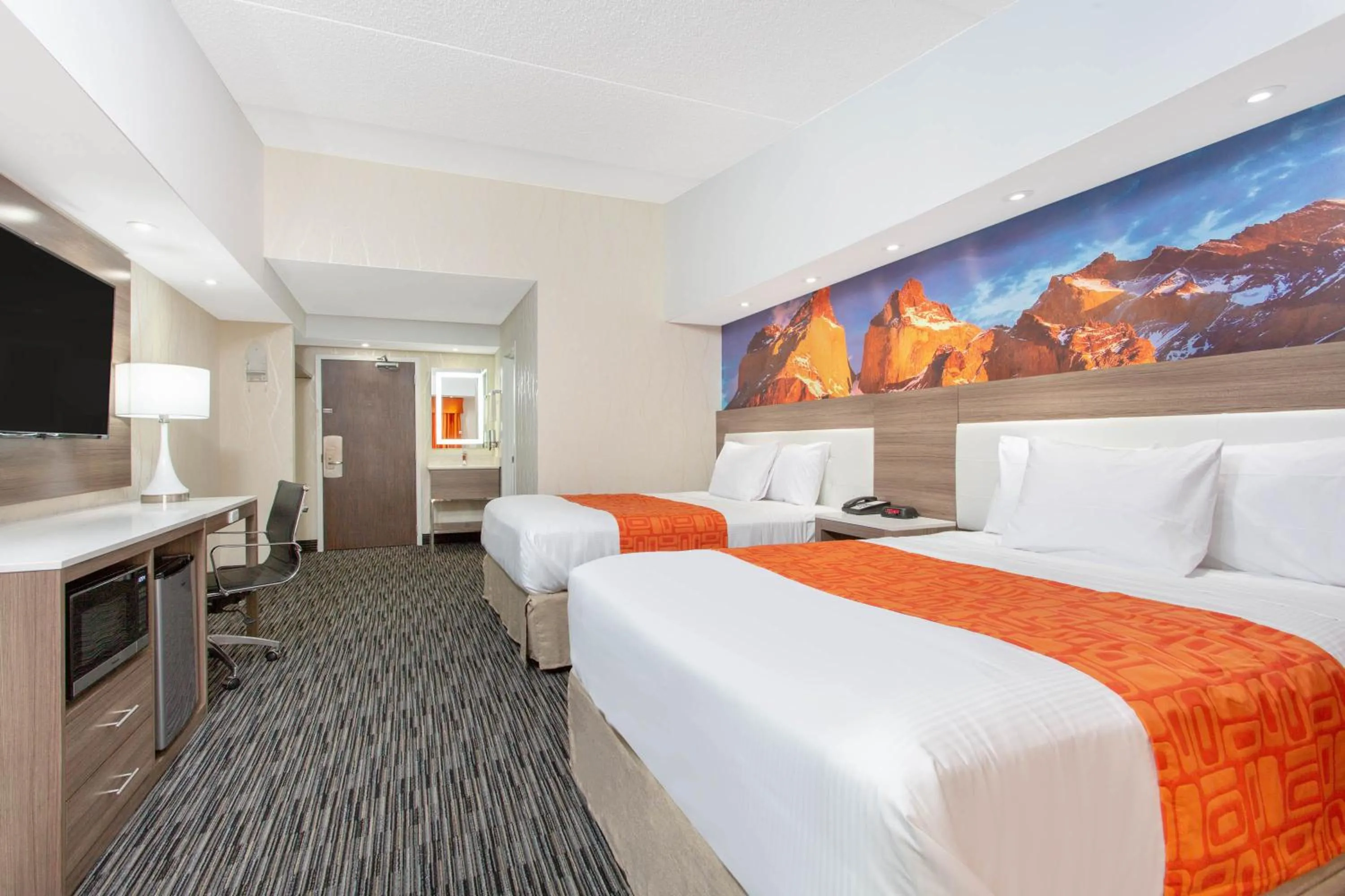 Bed in Howard Johnson by Wyndham Harrisburg