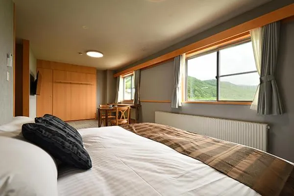 Bed in Hotel Takimoto